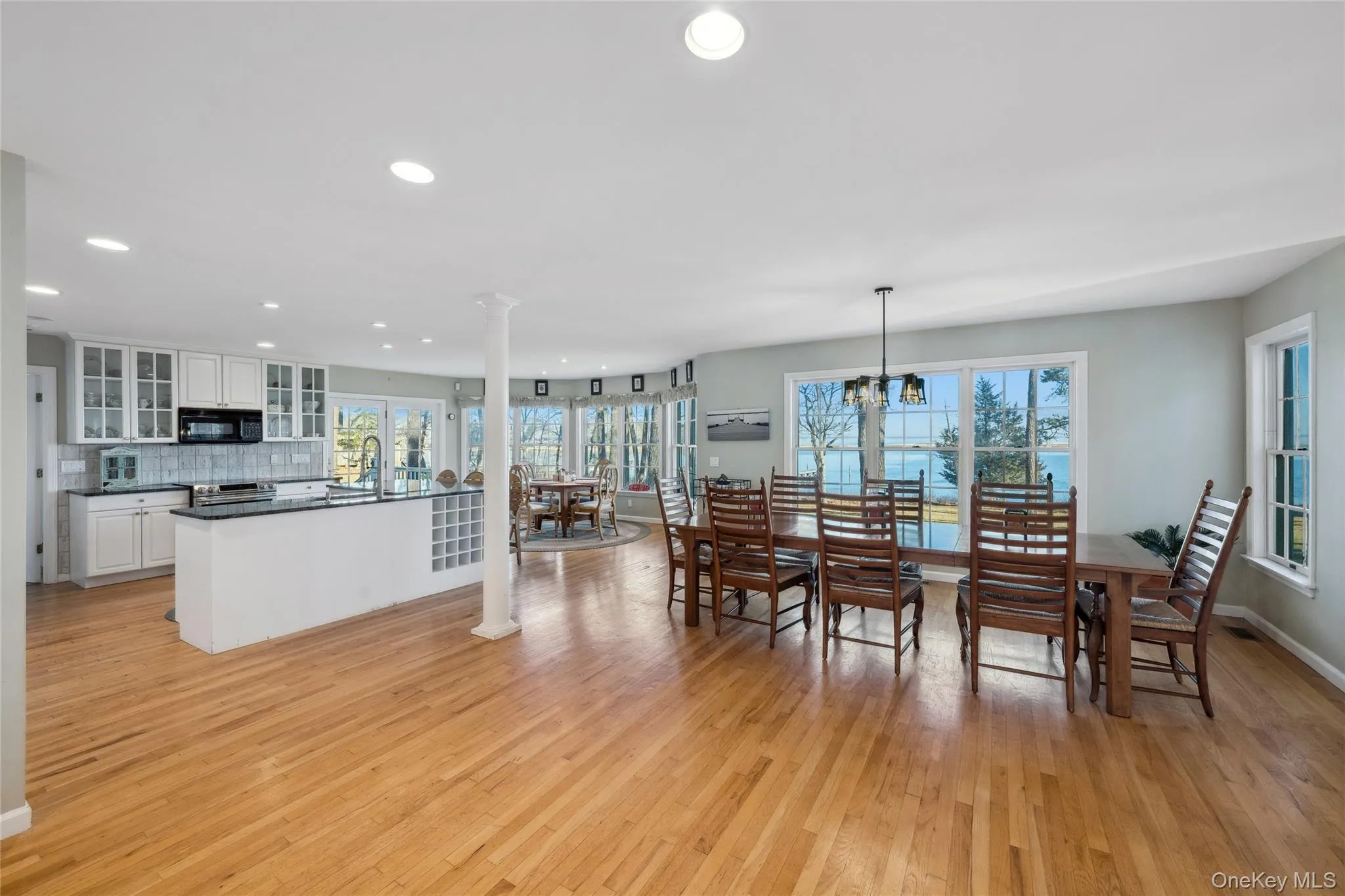 Dining area with a wealth of natural light, light wood finished floors, and recessed lighting Dining area with a wealth of natural light, light wood finished floors, and recessed lighting