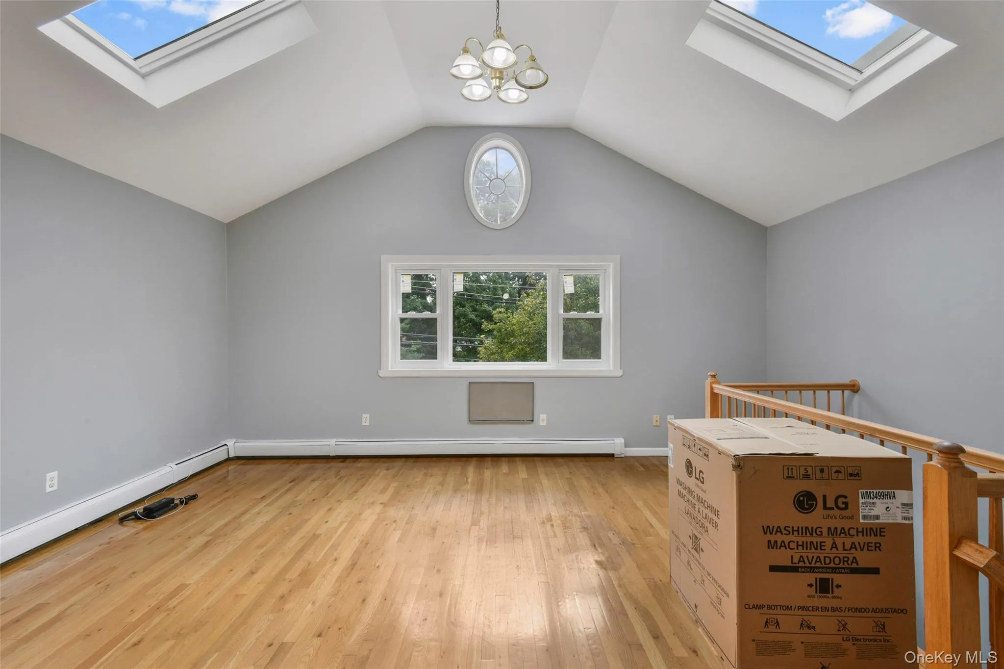 Light-filled Great Room w picture window, cathedral ceiling and skylights Light-filled Great Room w picture window, cathedral ceiling and skylights