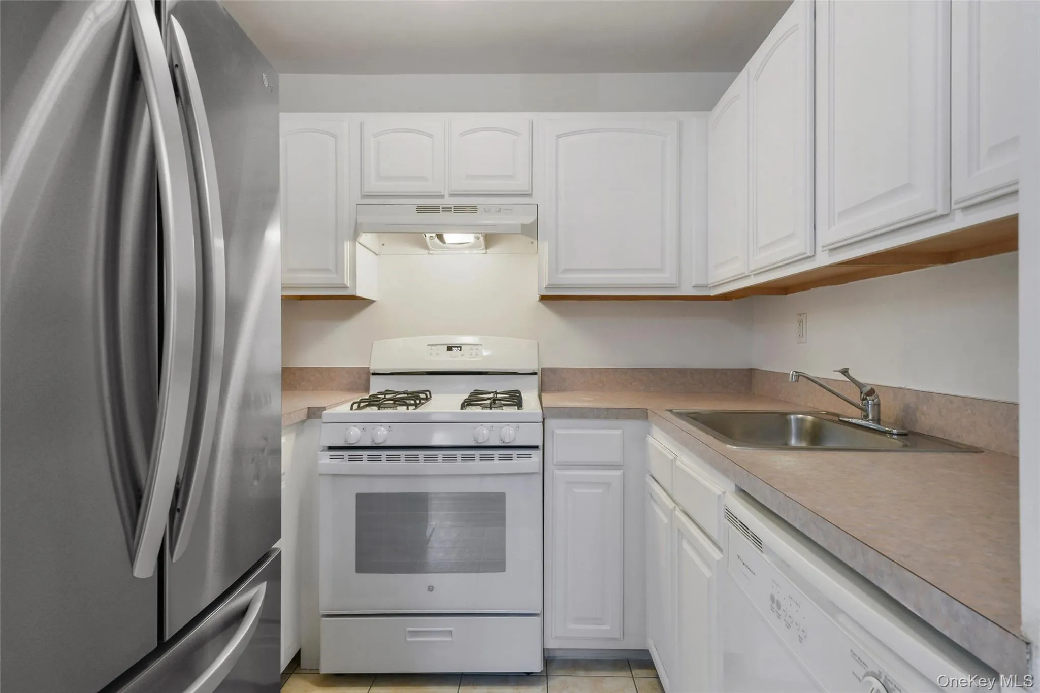 Kitchen gas range. Dishwasher and monthly water included. Landlord will provide smaller white refrigerator in better scale for space. Kitchen gas range. Dishwasher and monthly water included. Landlord will provide smaller white refrigerator in better scale for space.