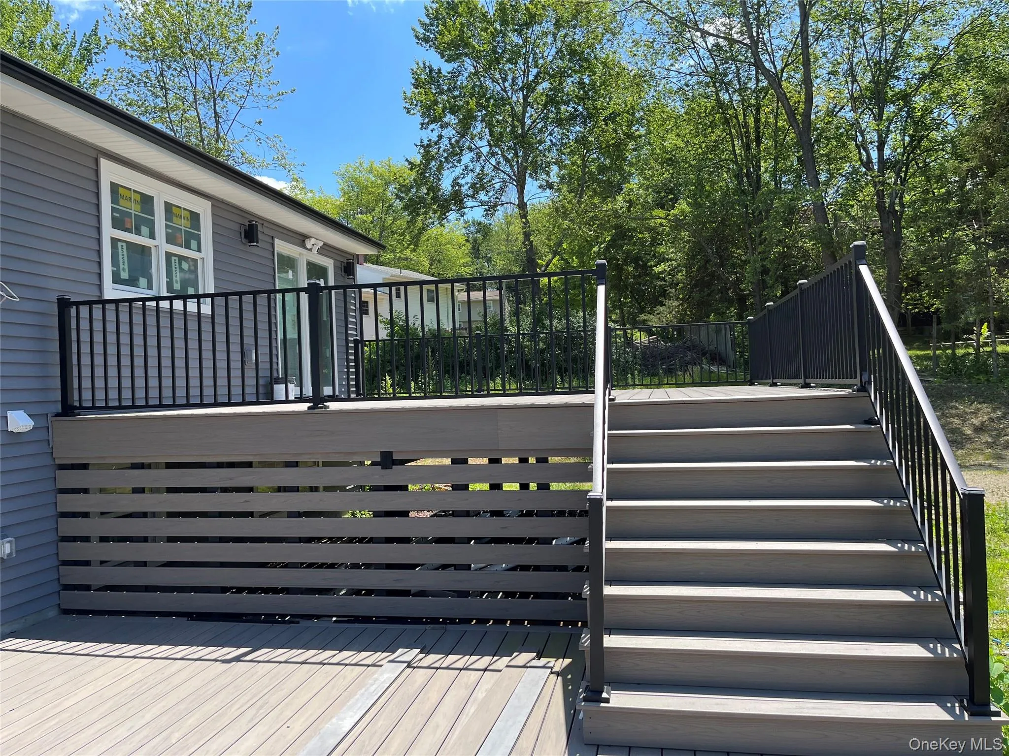 Wooden deck featuring stairs Wooden deck featuring stairs