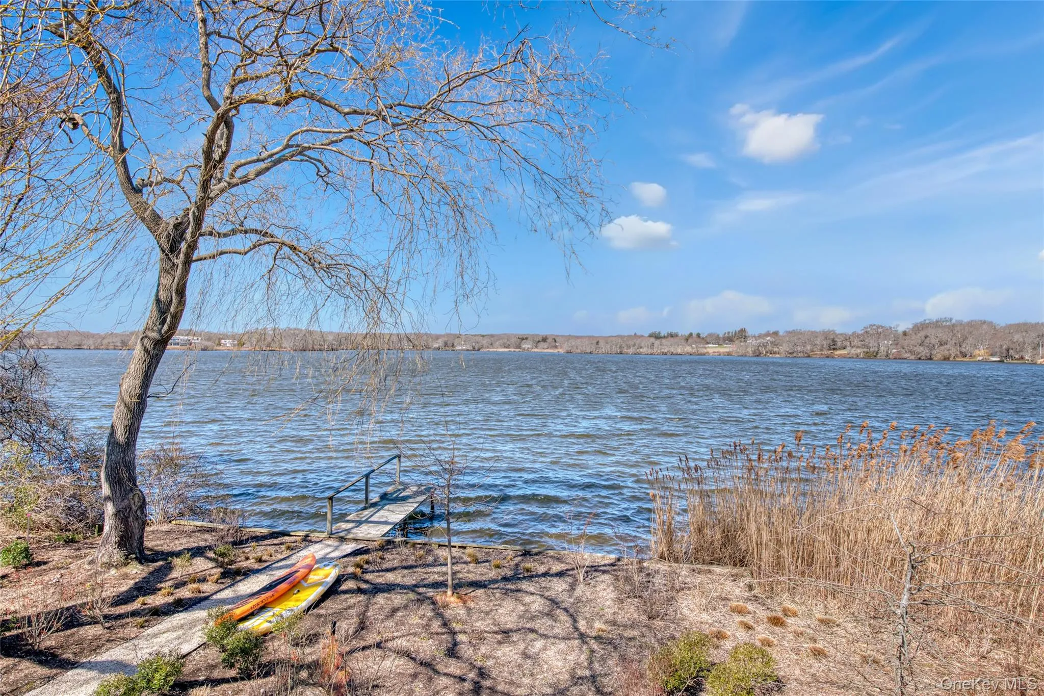 Property view of water with a boat dock Property view of water with a boat dock