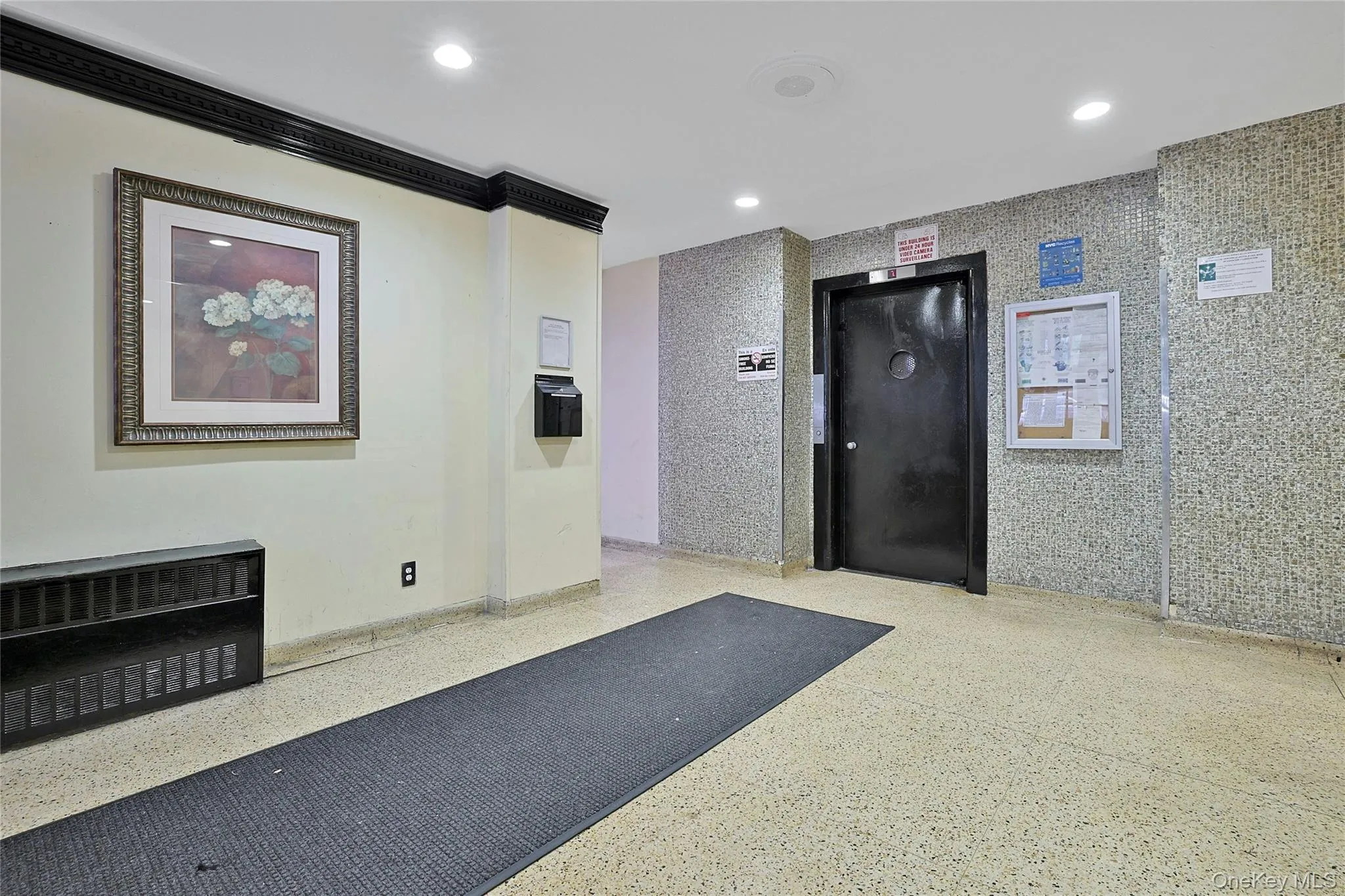 Community lobby with recessed lighting and crown molding Community lobby with recessed lighting and crown molding