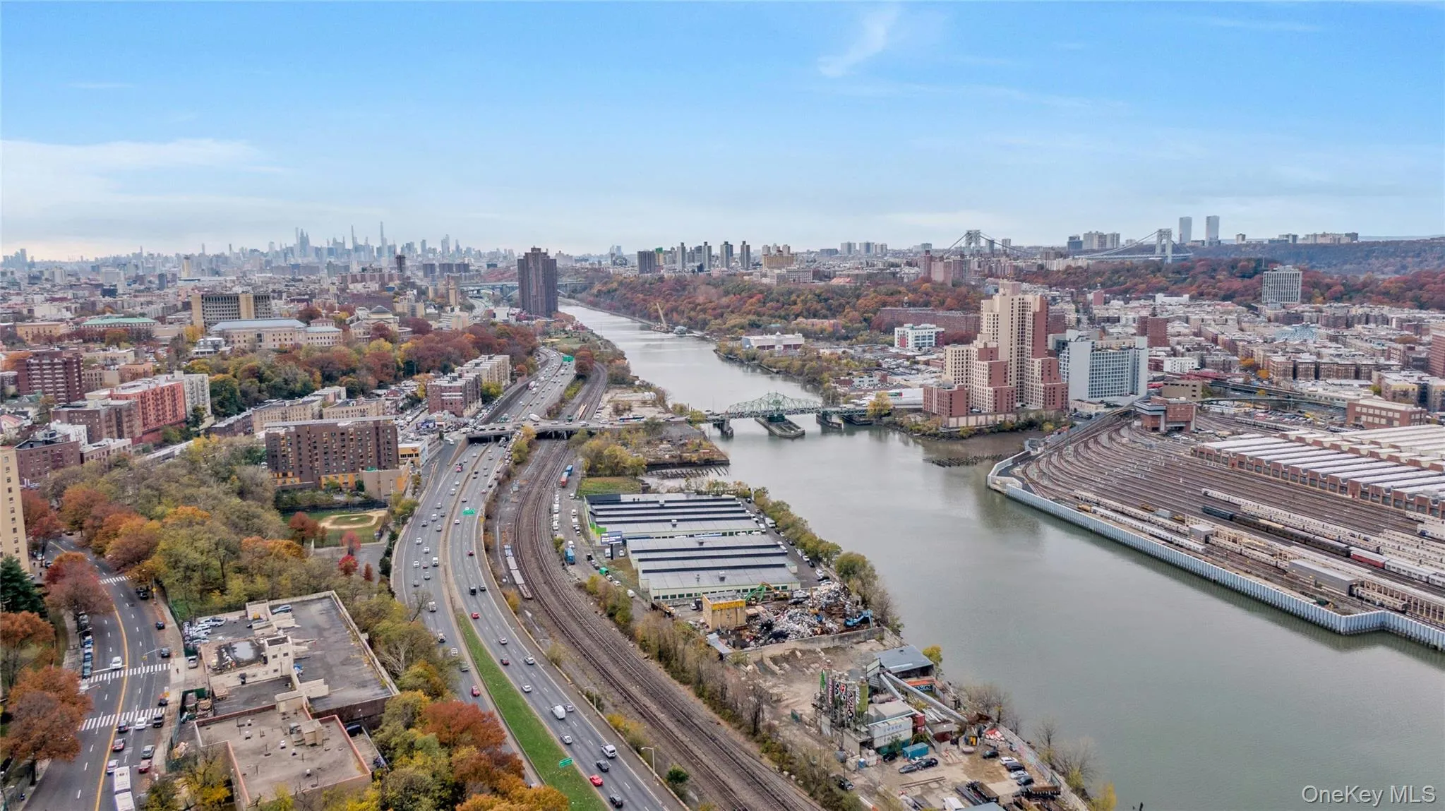 Bird's eye view of skyline and a large body of water Bird's eye view of skyline and a large body of water
