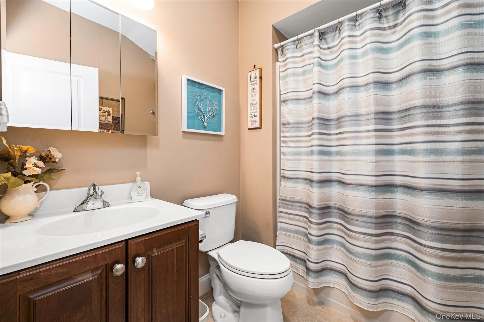 Full bath featuring vanity and a shower. Full bath featuring vanity and a shower.