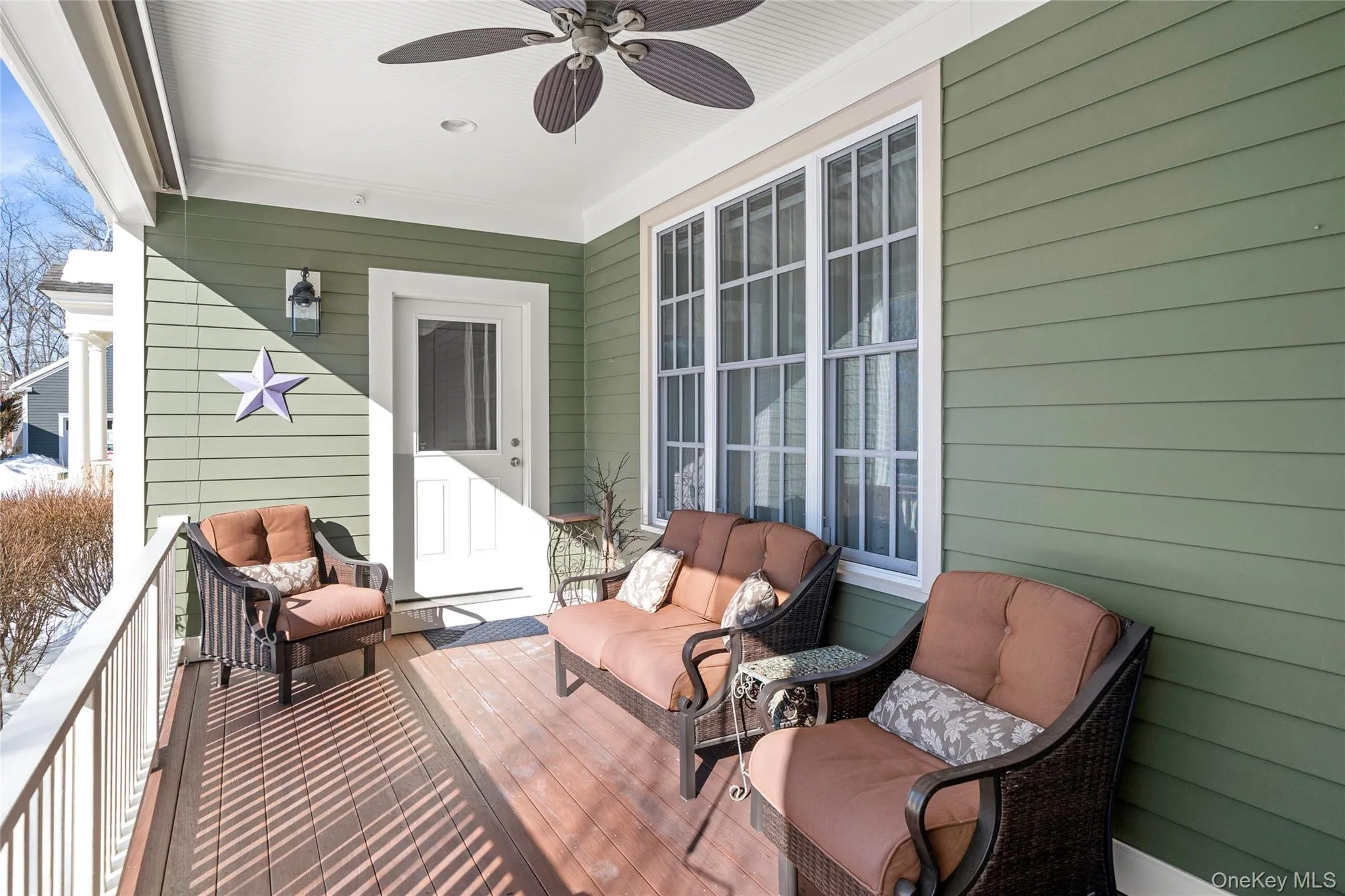 Covered Porch with a ceiling fan and a roll-down shade. Covered Porch with a ceiling fan and a roll-down shade.
