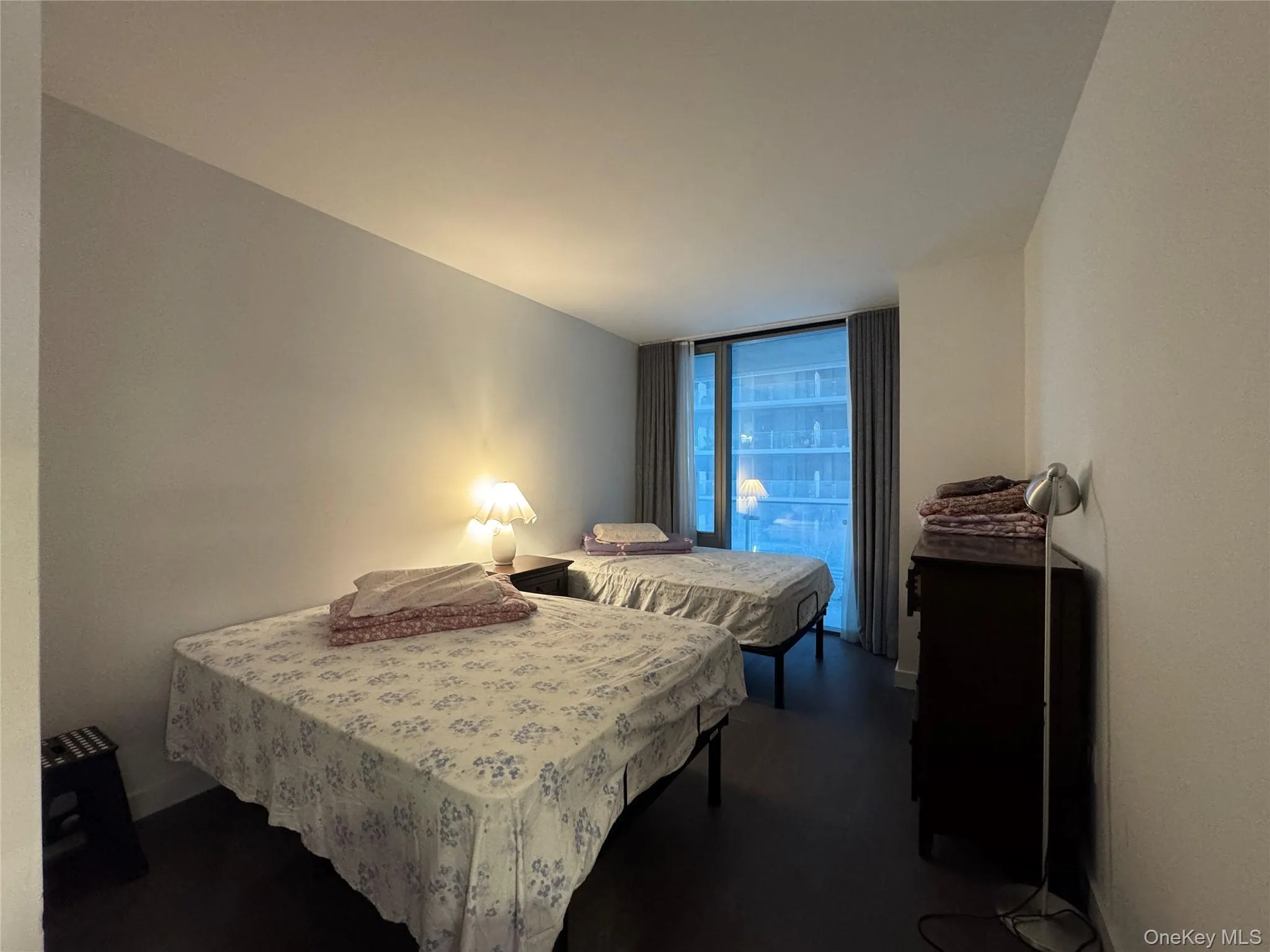 Bedroom featuring floor to ceiling windows Bedroom featuring floor to ceiling windows