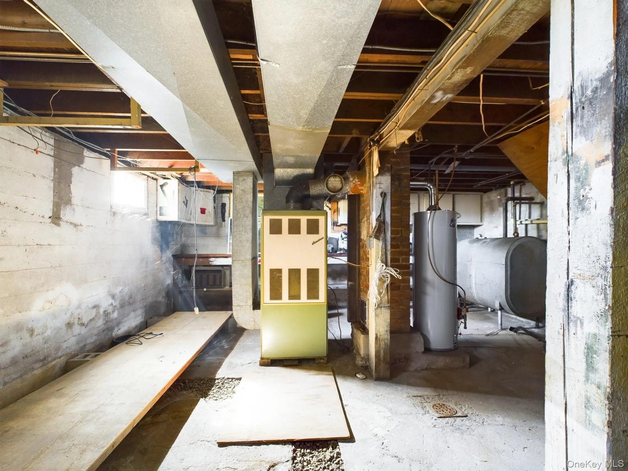 Below grade area with heating fuel, heating unit, and gas water heater Below grade area with heating fuel, heating unit, and gas water heater