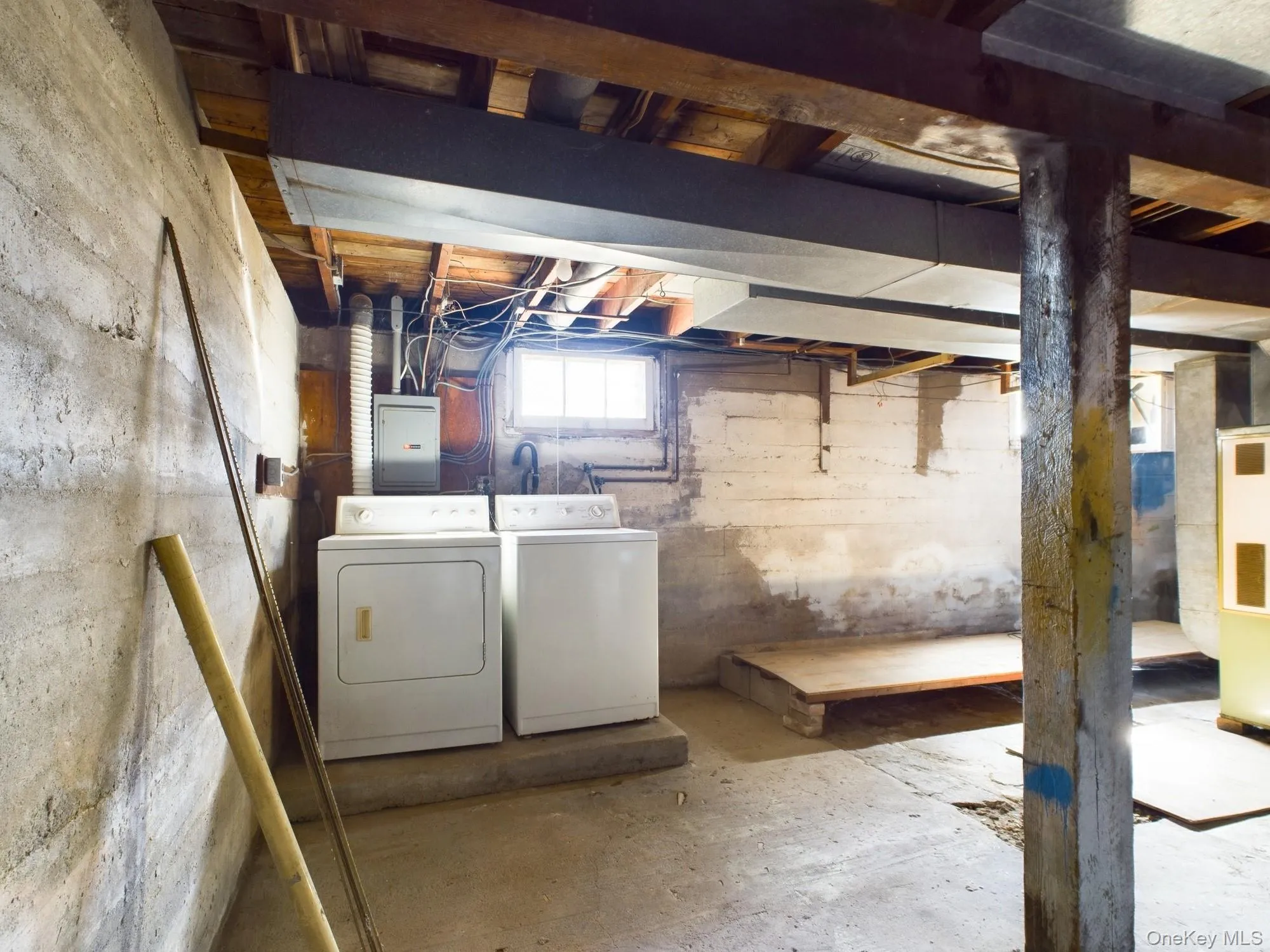 Basement featuring independent washer and dryer and electric panel Basement featuring independent washer and dryer and electric panel