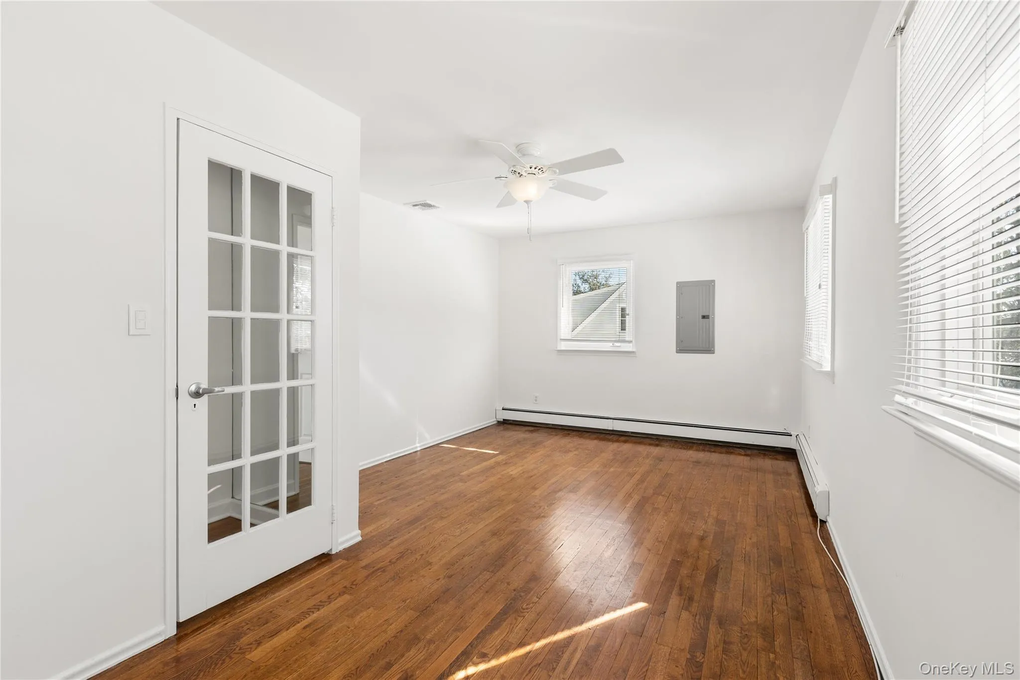 Top floor bedroom with a baseboard heating, hardwood flooring, ceiling fan, closet Top floor bedroom with a baseboard heating, hardwood flooring, ceiling fan, closet