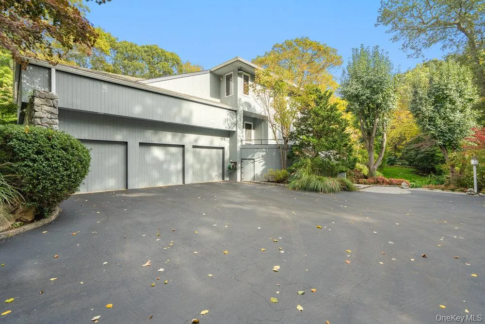 View of 3 car garage and one entrance to backyard View of 3 car garage and one entrance to backyard