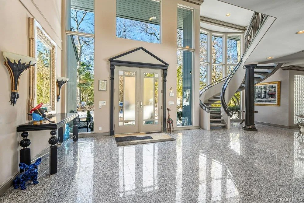 View of entry with soaring ceilings and light filled rooms View of entry with soaring ceilings and light filled rooms