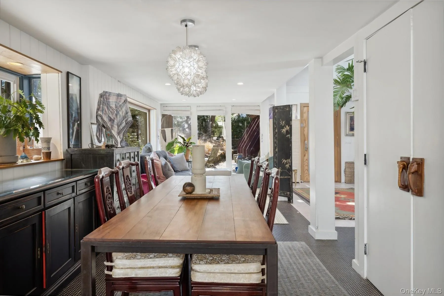 Dining room with a notable chandelier Dining room with a notable chandelier