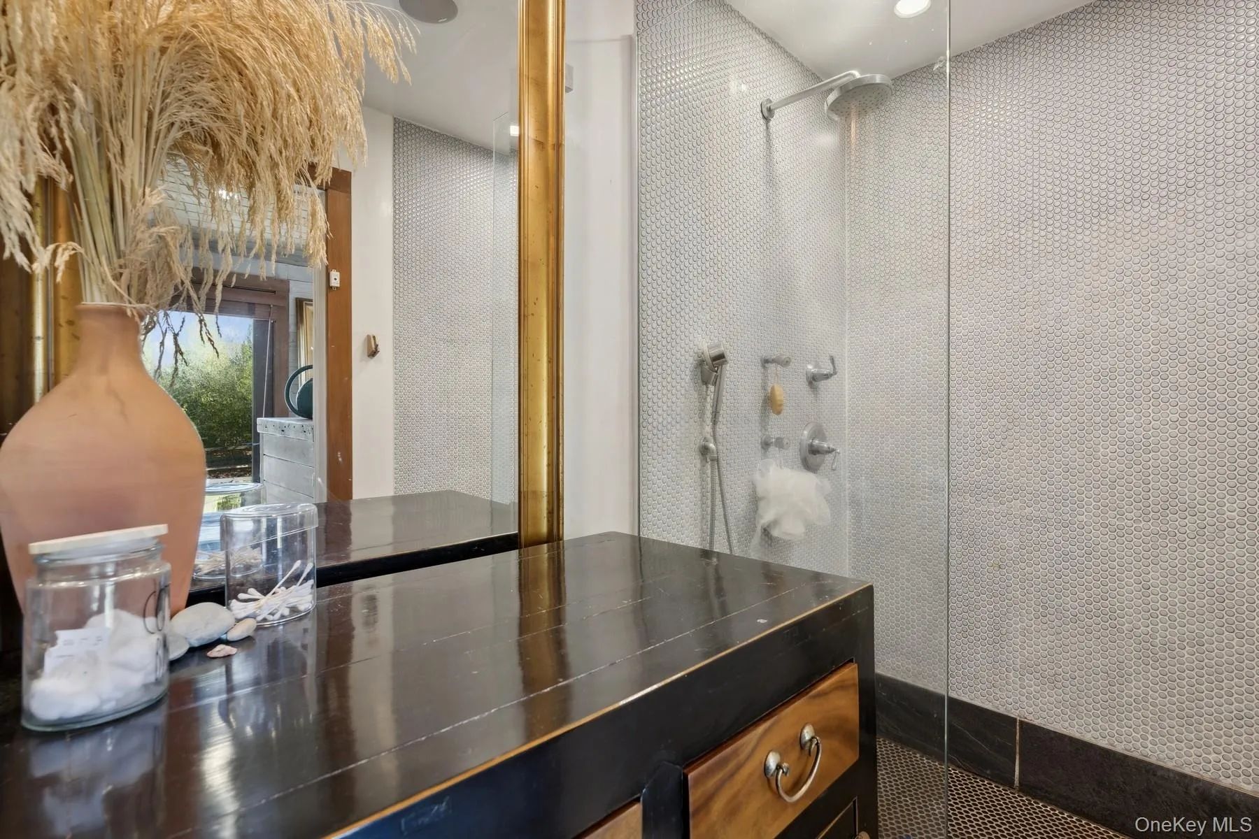 Bathroom featuring a tile shower Bathroom featuring a tile shower