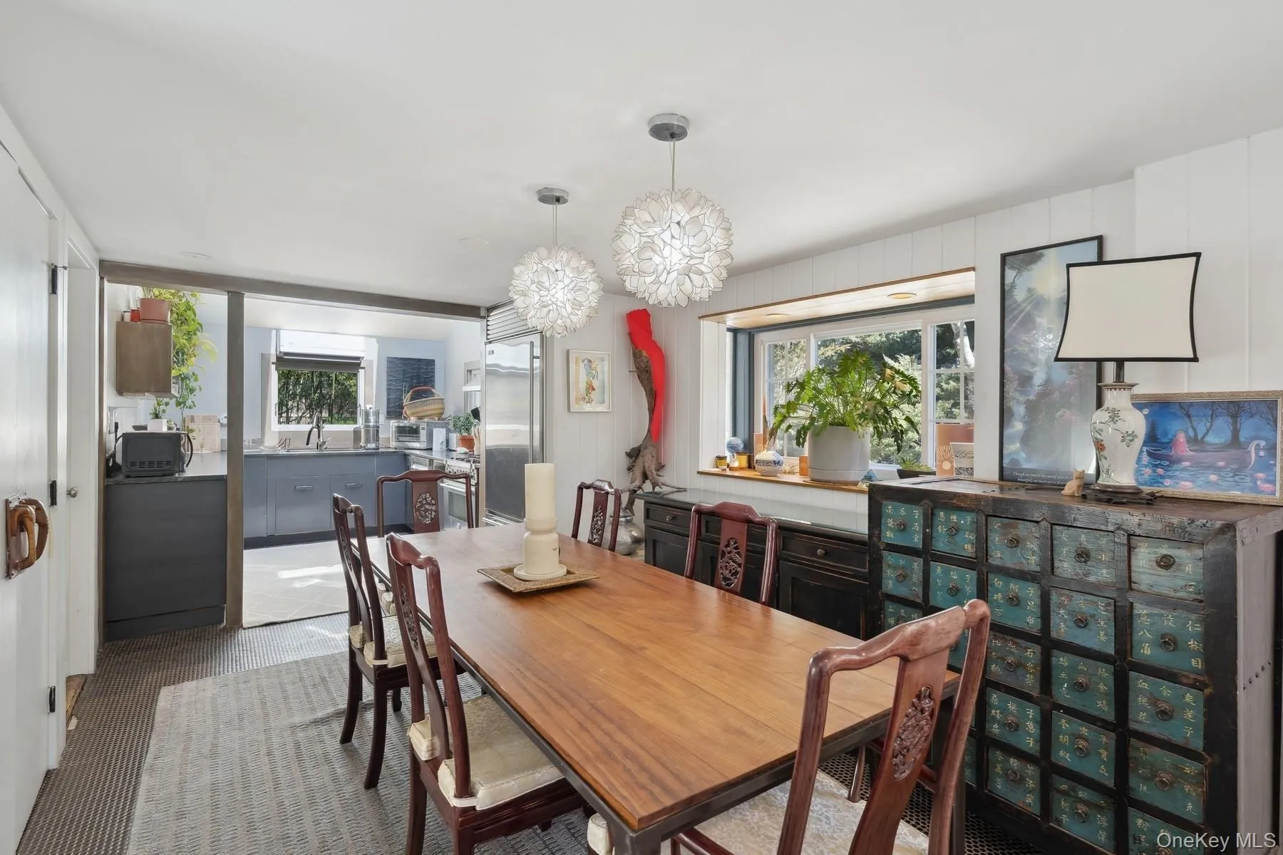 Dining space featuring sink and a chandelier Dining space featuring sink and a chandelier