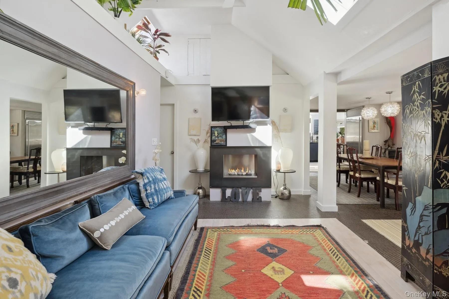 Living room featuring high vaulted ceiling Living room featuring high vaulted ceiling