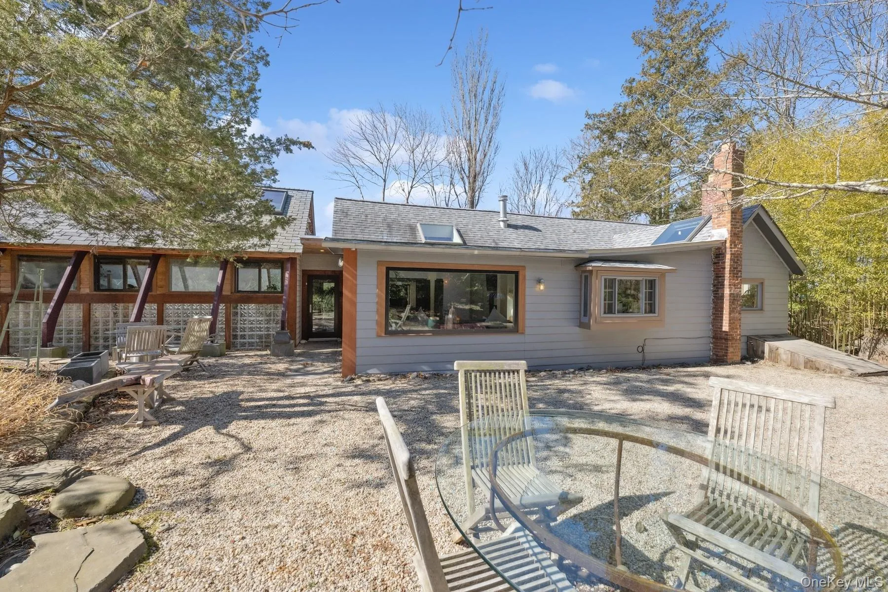 Rear view of property with a patio area Rear view of property with a patio area