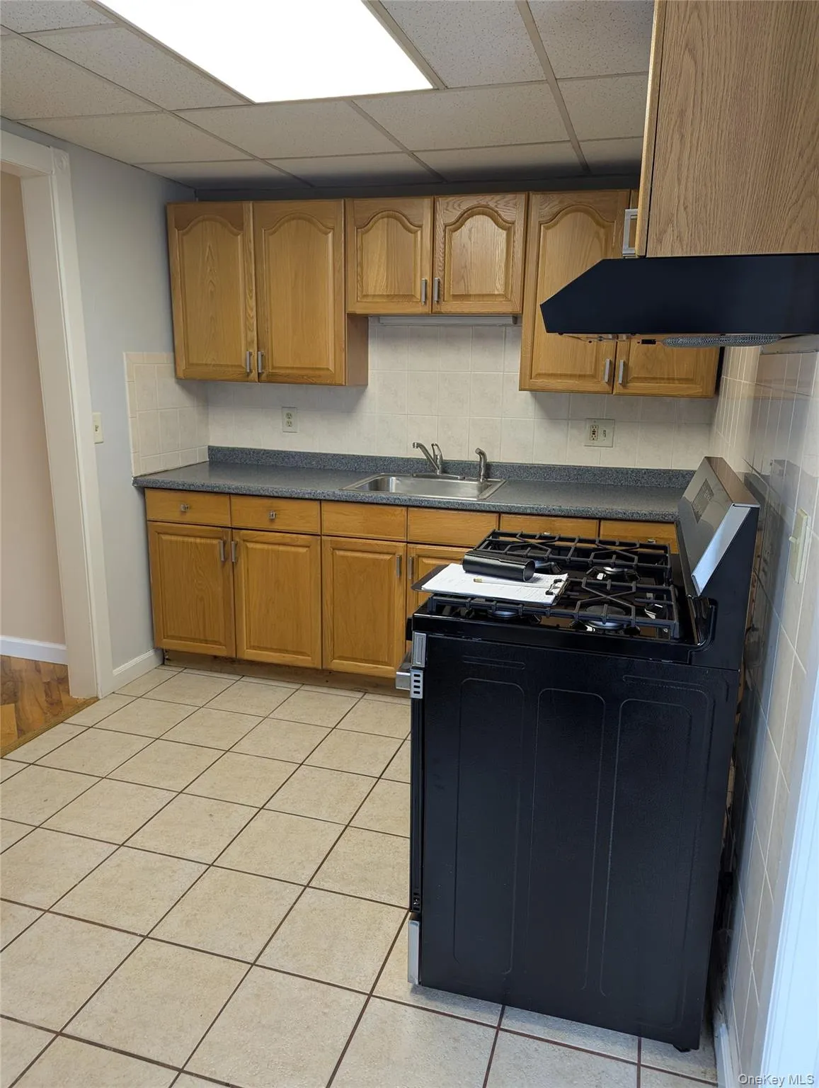 Kitchen. New stove, sink, and refrigerator Kitchen. New stove, sink, and refrigerator