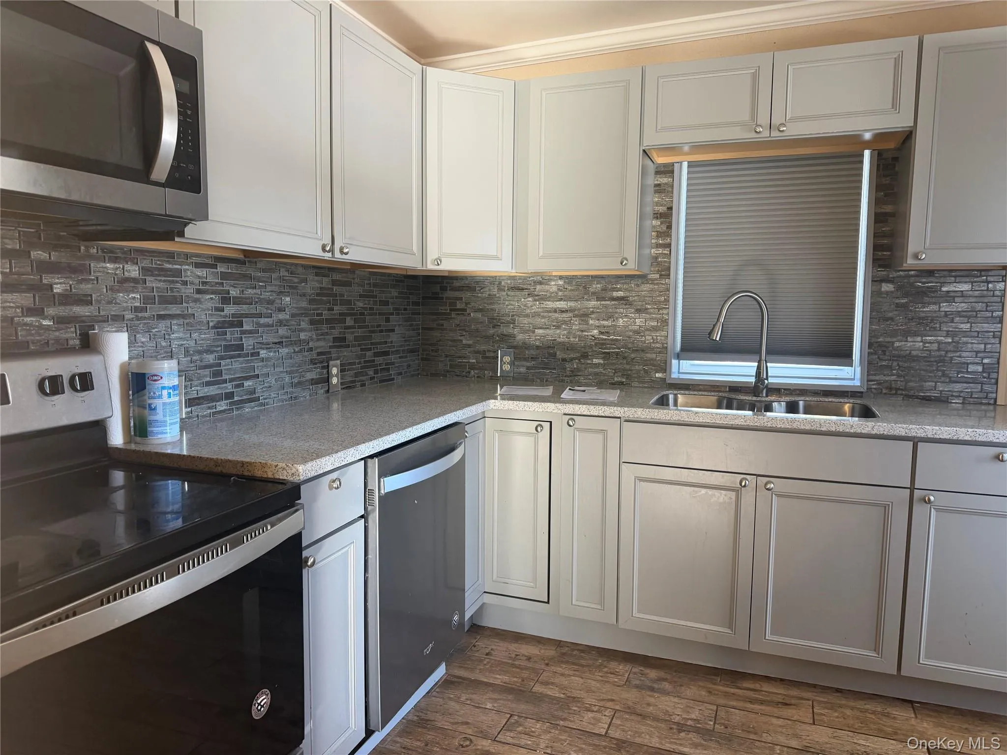 Large kitchen with dishwasher and stainless steel appliances Large kitchen with dishwasher and stainless steel appliances