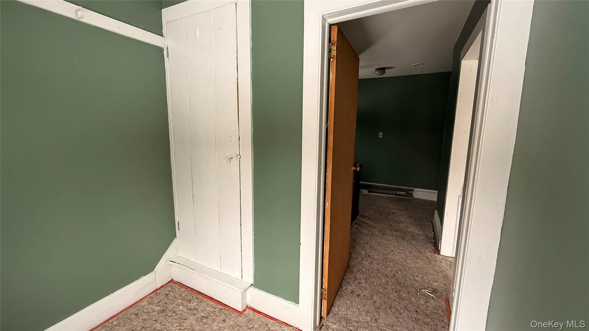 Door to 2nd level. and hall Door to 2nd level. and hall