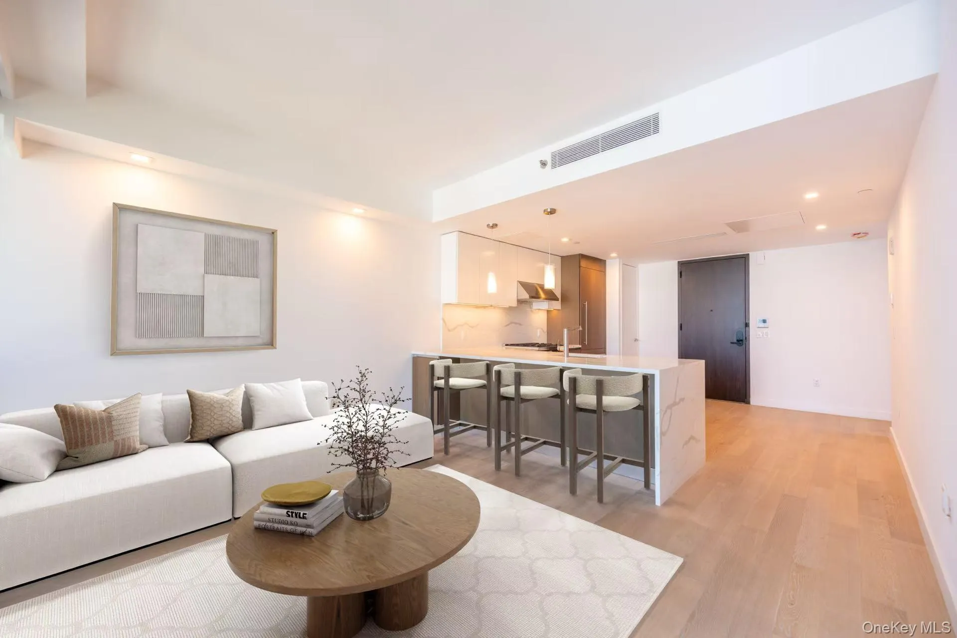Living room with light wood-type flooring, visible vents, and recessed lighting Living room with light wood-type flooring, visible vents, and recessed lighting