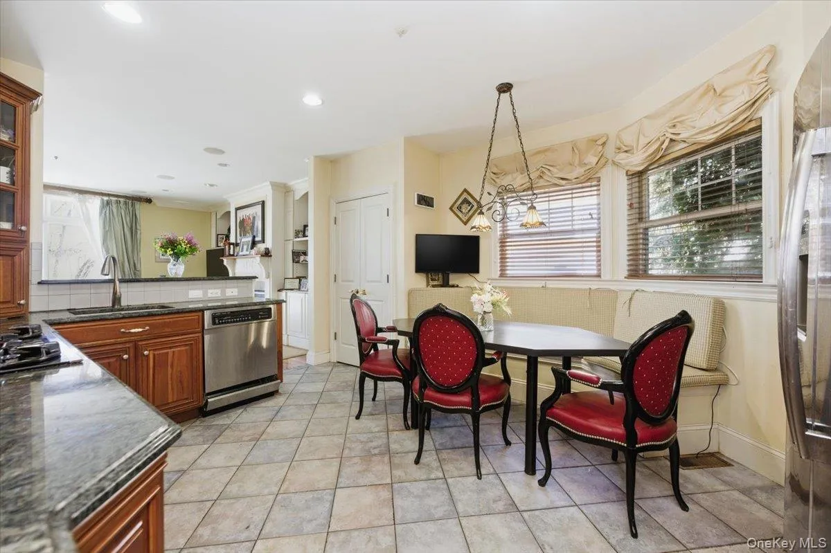 Dining room with baseboards and hanging lights Dining room with baseboards and hanging lights