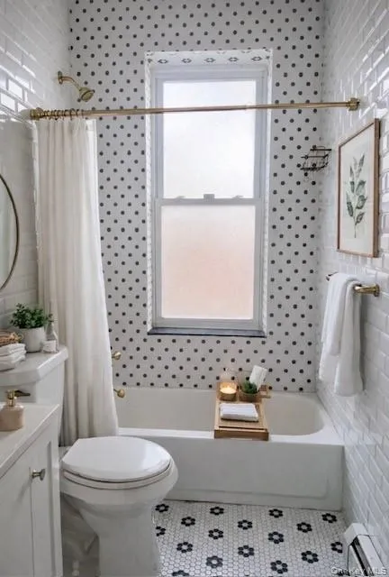 Fresh and clean with classic finishes, the bathroom features a full tub, crisp tilework, and natural light from the window — a rare bonus that keeps the space bright and well-ventilated. Simple, modern, and easy to maintain for everyday living. Fresh and clean with classic finishes, the bathroom features a full tub, crisp tilework, and natural light from the window — a rare bonus that keeps the space bright and well-ventilated. Simple, modern, and easy to maintain for everyday living.