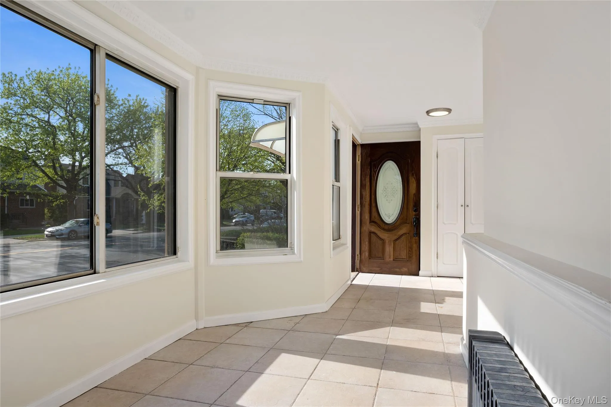 Foyer with baseboards and light tile patterned floors Foyer with baseboards and light tile patterned floors