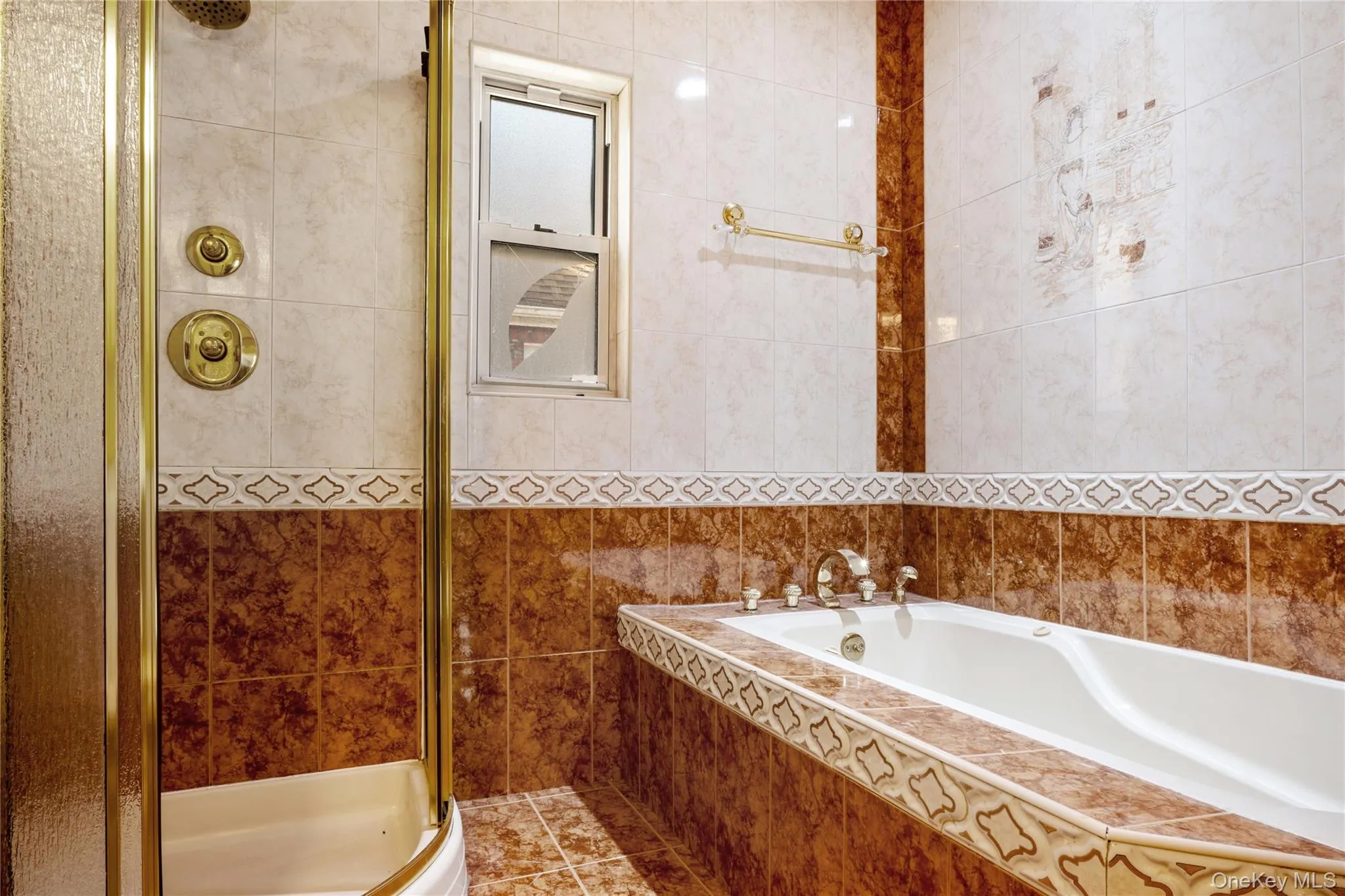 Full bath featuring tile walls, a garden tub, and a stall shower Full bath featuring tile walls, a garden tub, and a stall shower