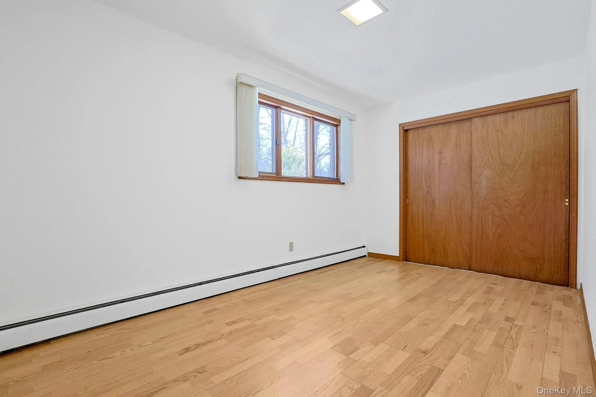 The private lower level bedroom is set apart from much of the rest of the home and has a large closet. The private lower level bedroom is set apart from much of the rest of the home and has a large closet.