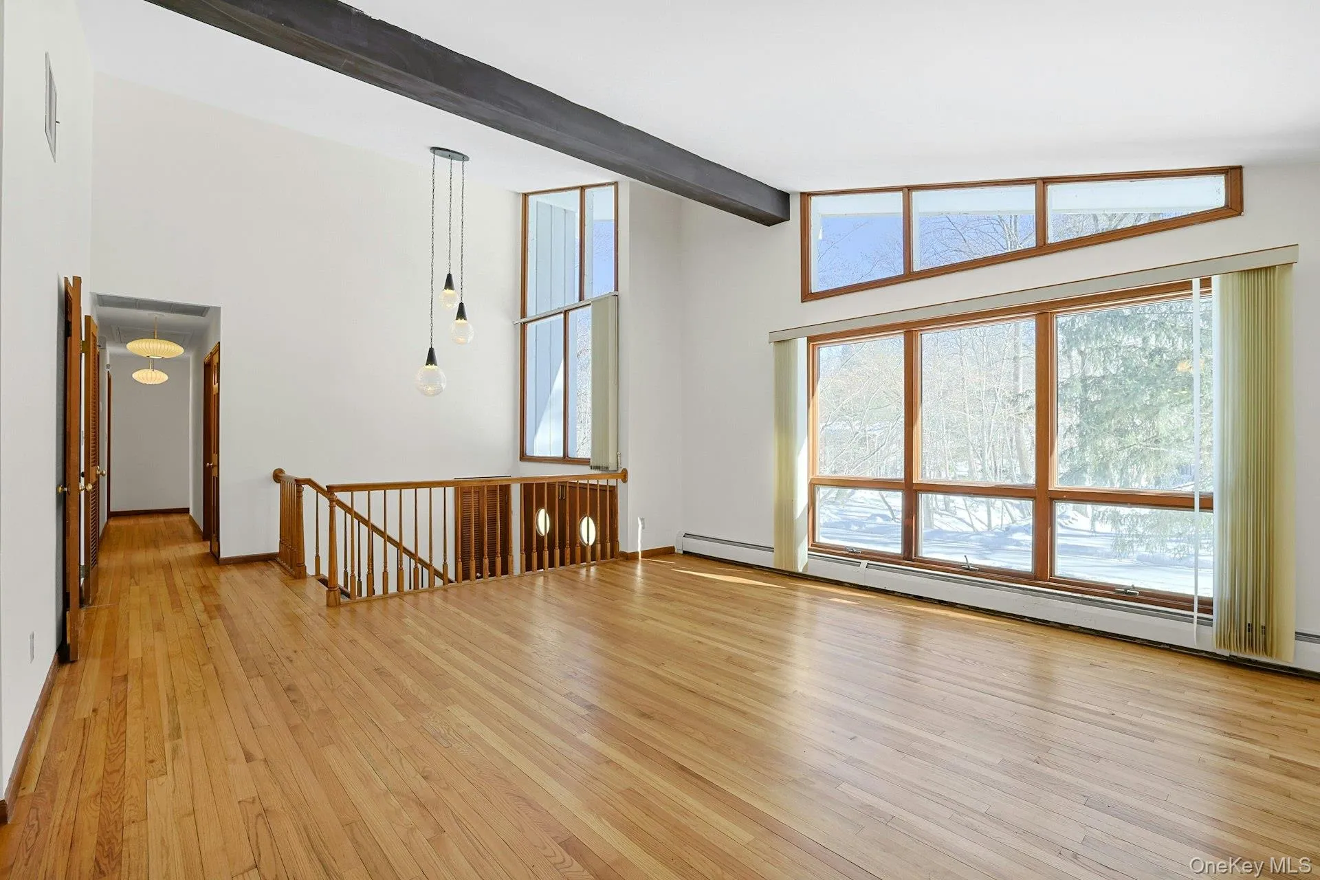 The beamed ceilings soar high above, making these rooms open and pleasant. Down the hallway, we head to the bedrooms on this floor. The beamed ceilings soar high above, making these rooms open and pleasant. Down the hallway, we head to the bedrooms on this floor.
