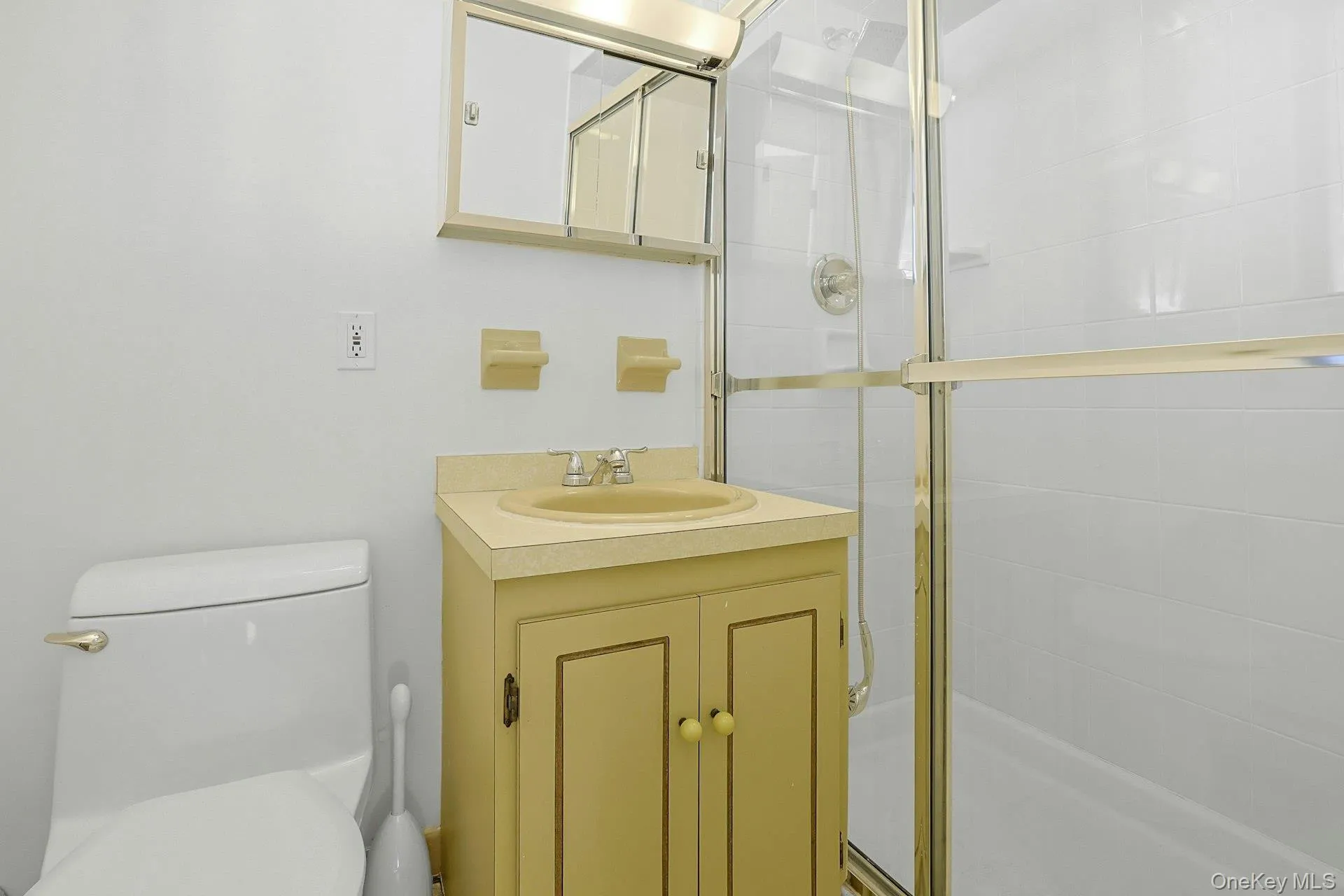 Off of the den, the third bathroom has a tile surround, glass shower. Off of the den, the third bathroom has a tile surround, glass shower.
