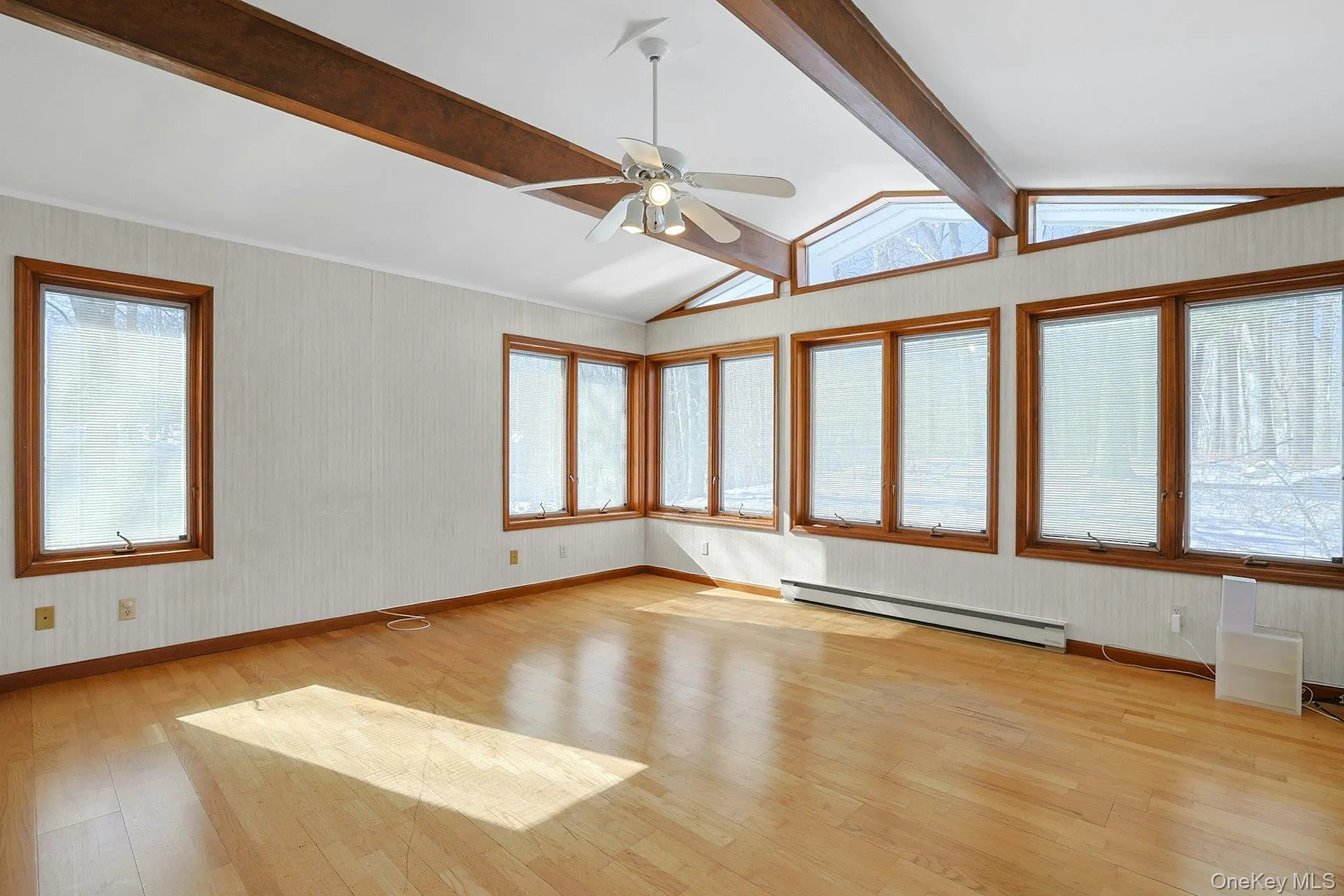 The large family room in the rear of the home has walls of windows and is a perfect spot to relax after a long day. The large family room in the rear of the home has walls of windows and is a perfect spot to relax after a long day.