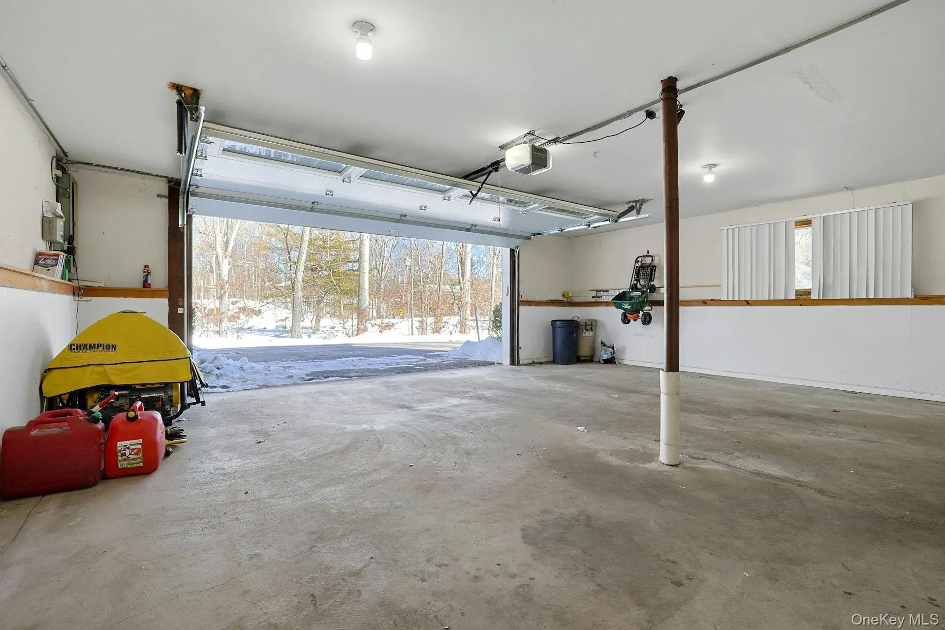 The attached two-car garage has bonus storage space and is just a few feet from the laundry room. On the left is the bonus backup generator. The attached two-car garage has bonus storage space and is just a few feet from the laundry room. On the left is the bonus backup generator.