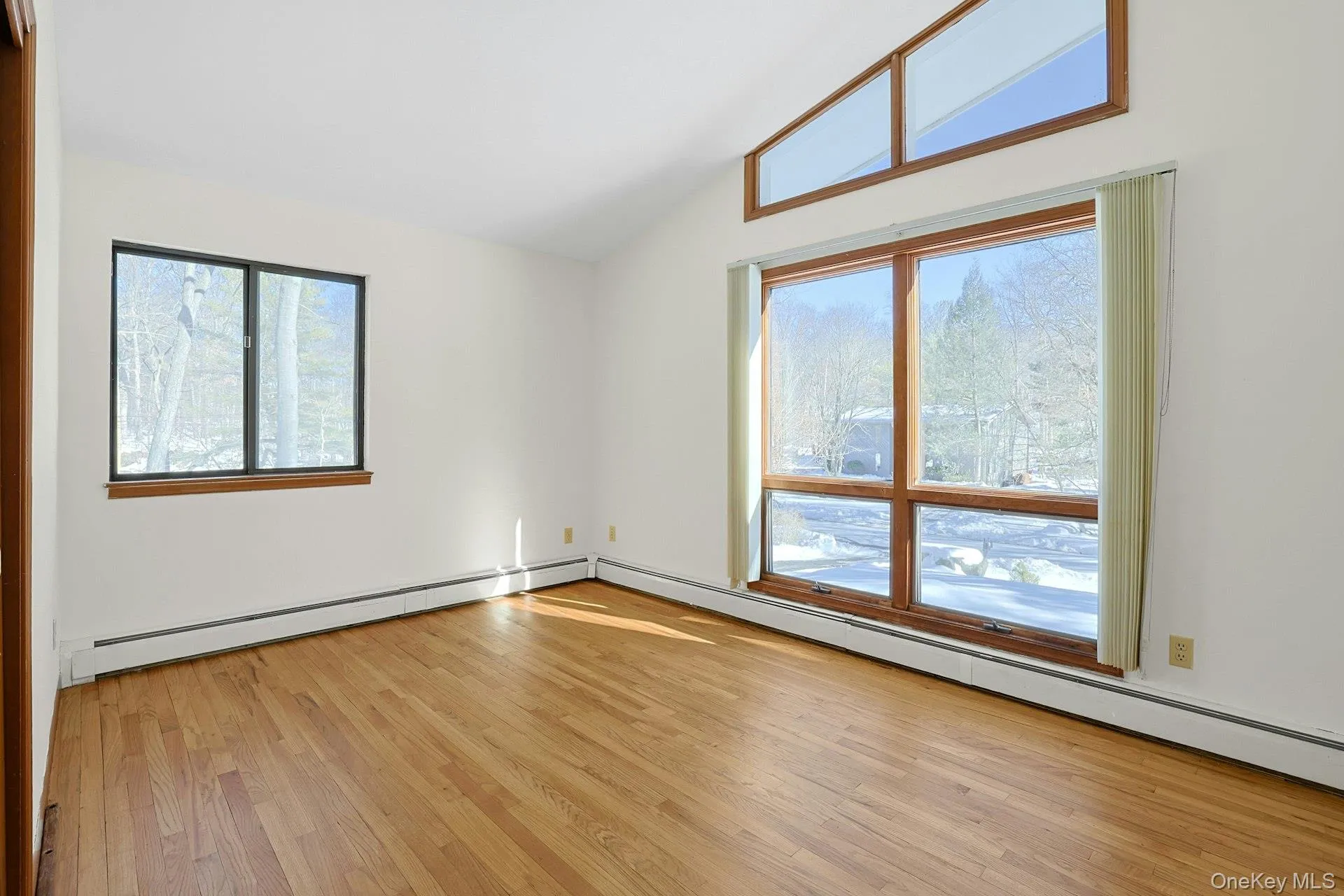 The second bedroom has a vaulted ceiling, ample closet space and the same warm wood floors as in much of the home. The second bedroom has a vaulted ceiling, ample closet space and the same warm wood floors as in much of the home.