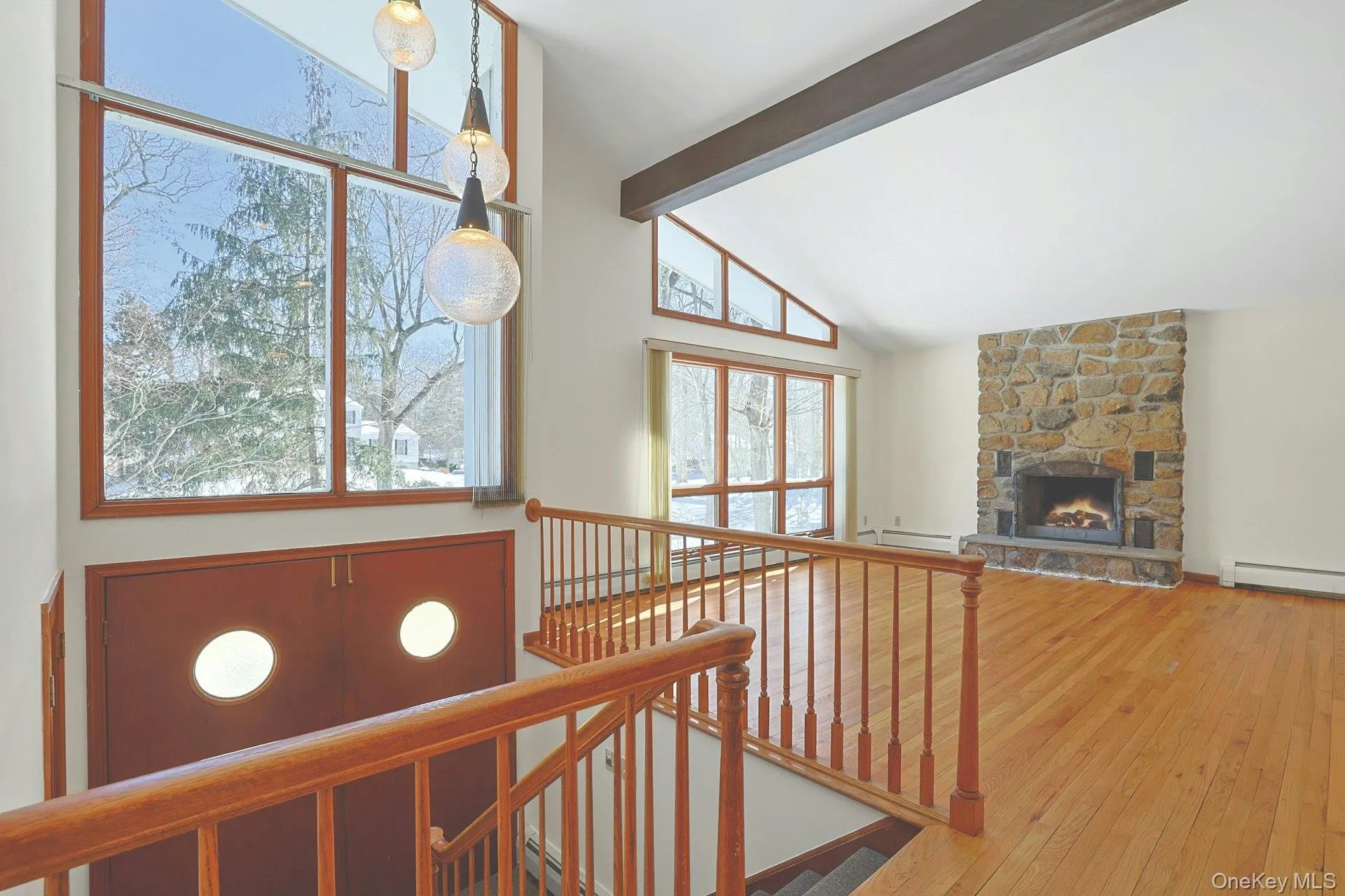 With soaring cathedral ceilings, massive windows that bring in abundant natural light, unique light fixtures and wood floors throughout most of the house, this is a wonderful place to come home to. With soaring cathedral ceilings, massive windows that bring in abundant natural light, unique light fixtures and wood floors throughout most of the house, this is a wonderful place to come home to.