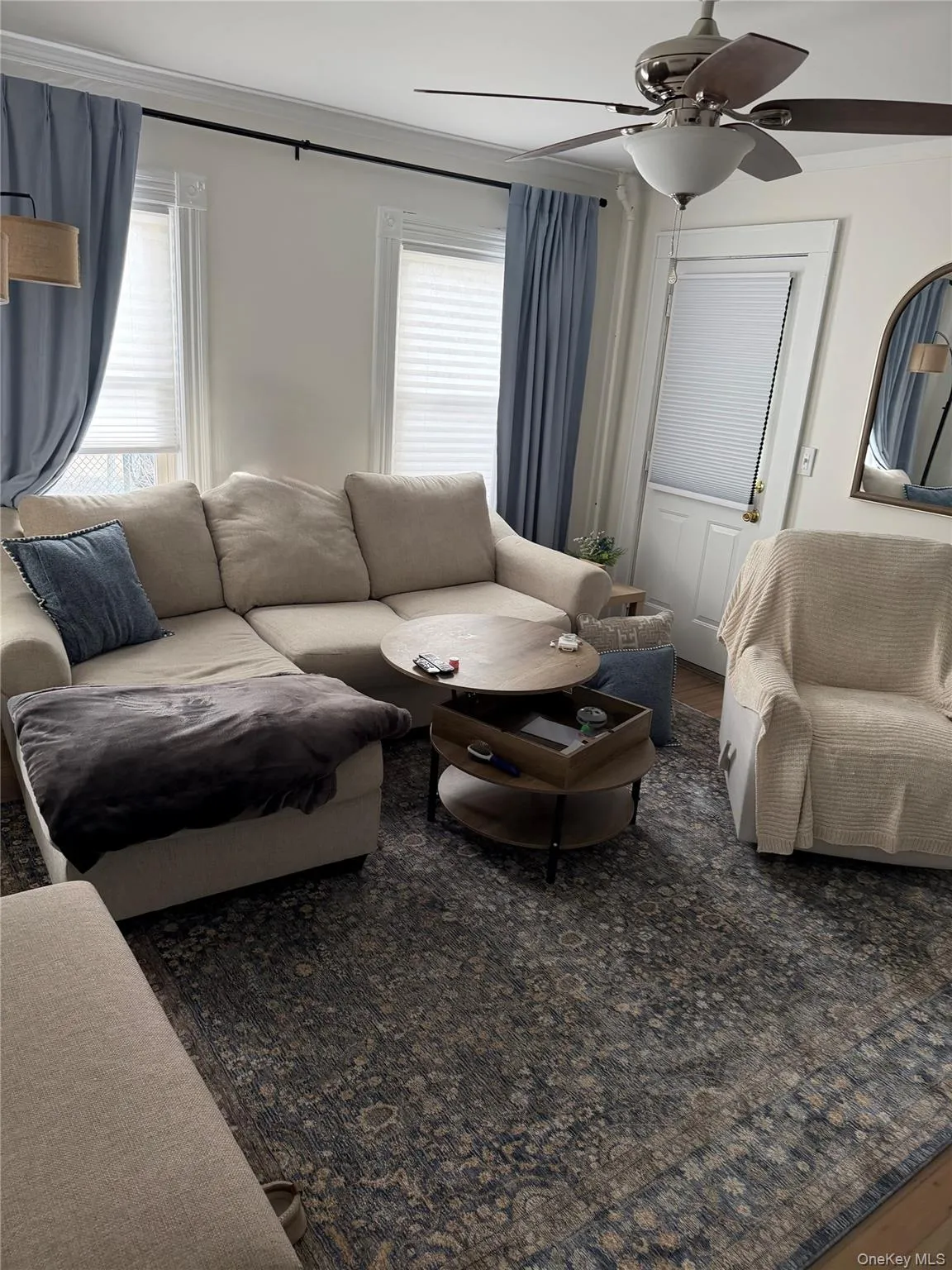 Living area featuring ceiling fan and vinyl wood finished floors. Living area featuring ceiling fan and vinyl wood finished floors.
