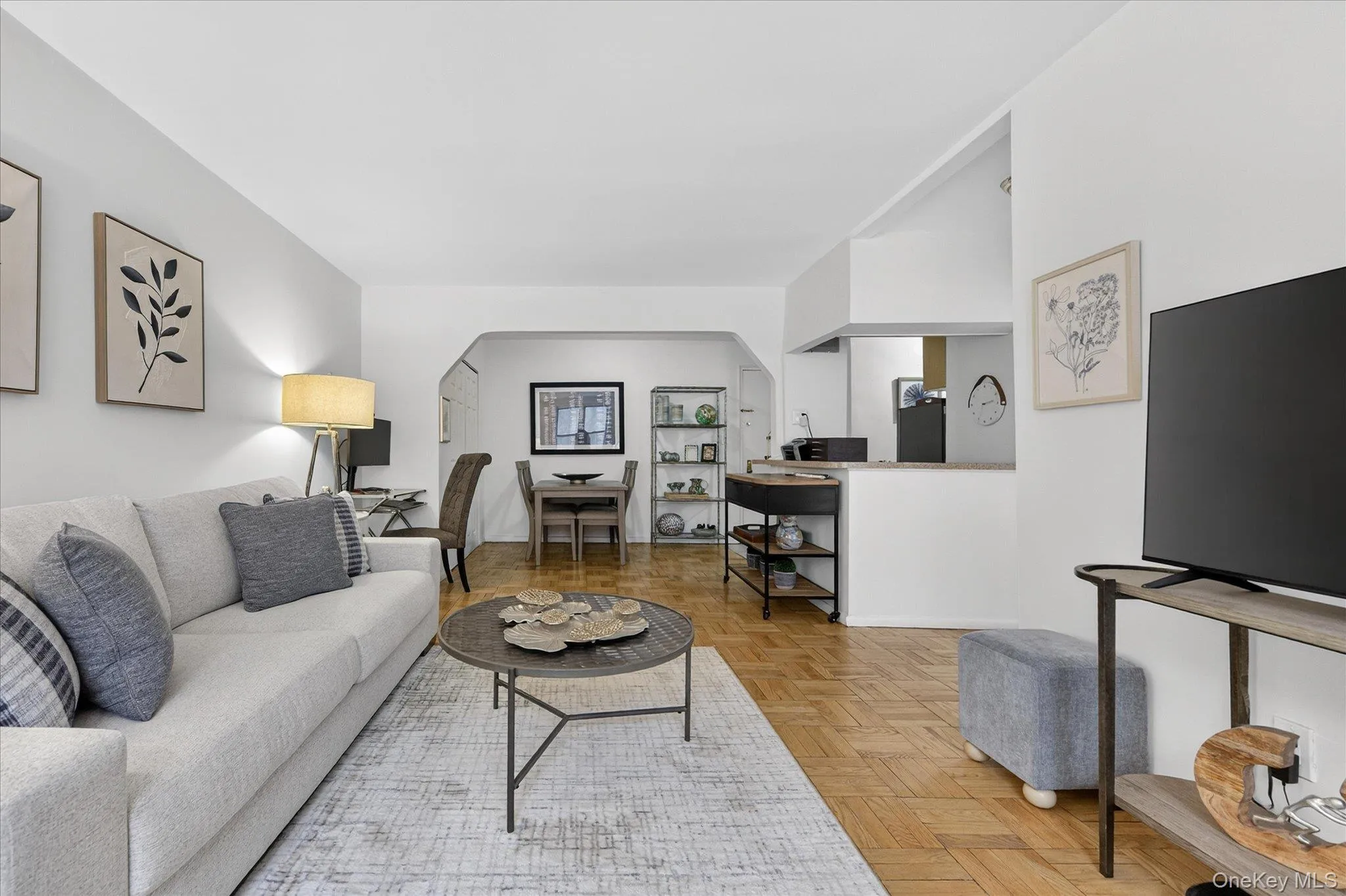 Living area with parquet floors and arched doorways Living area with parquet floors and arched doorways