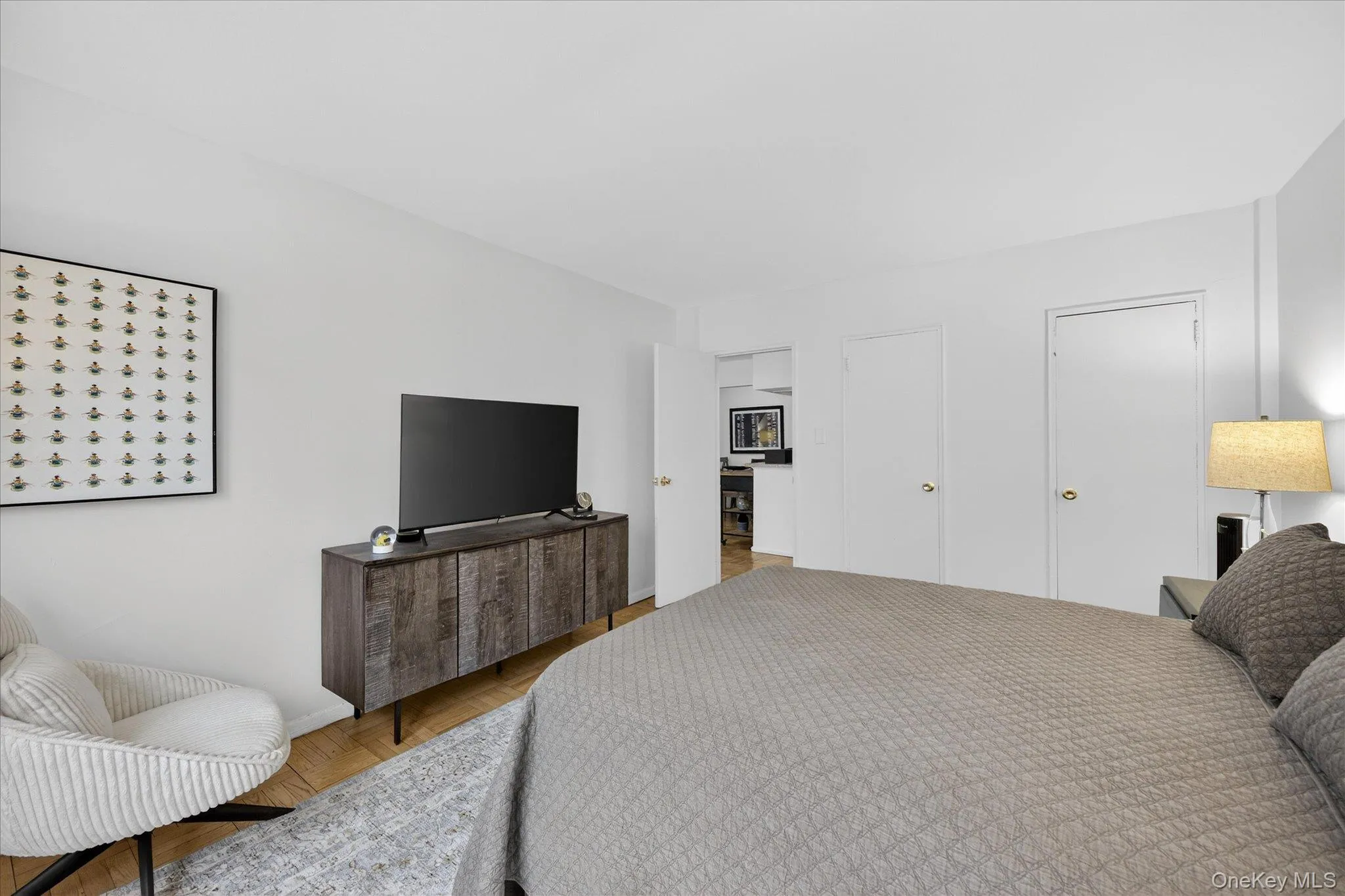 Bedroom featuring parquet flooring Bedroom featuring parquet flooring