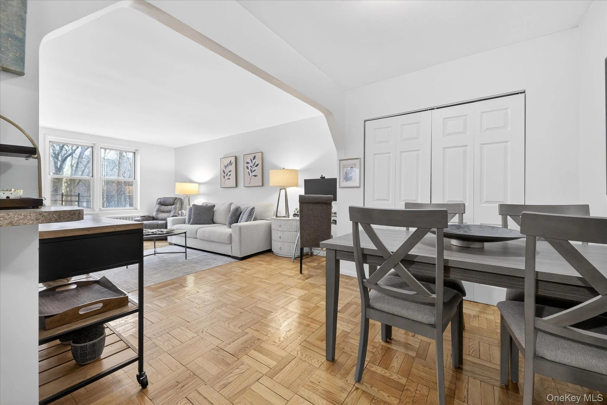 Dining area featuring parquet flooring Dining area featuring parquet flooring