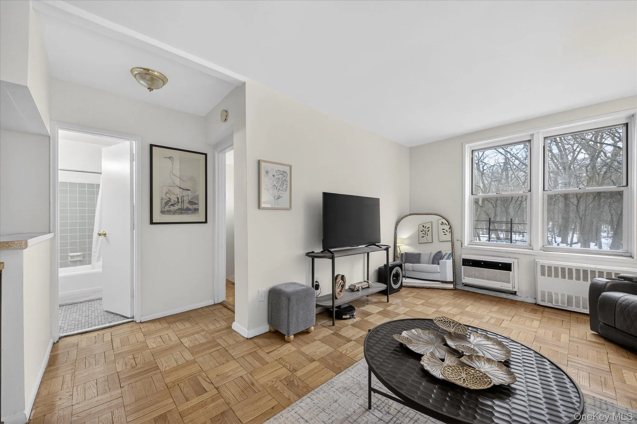 Living room with beautiful park views and windows allowing lots of light Living room with beautiful park views and windows allowing lots of light
