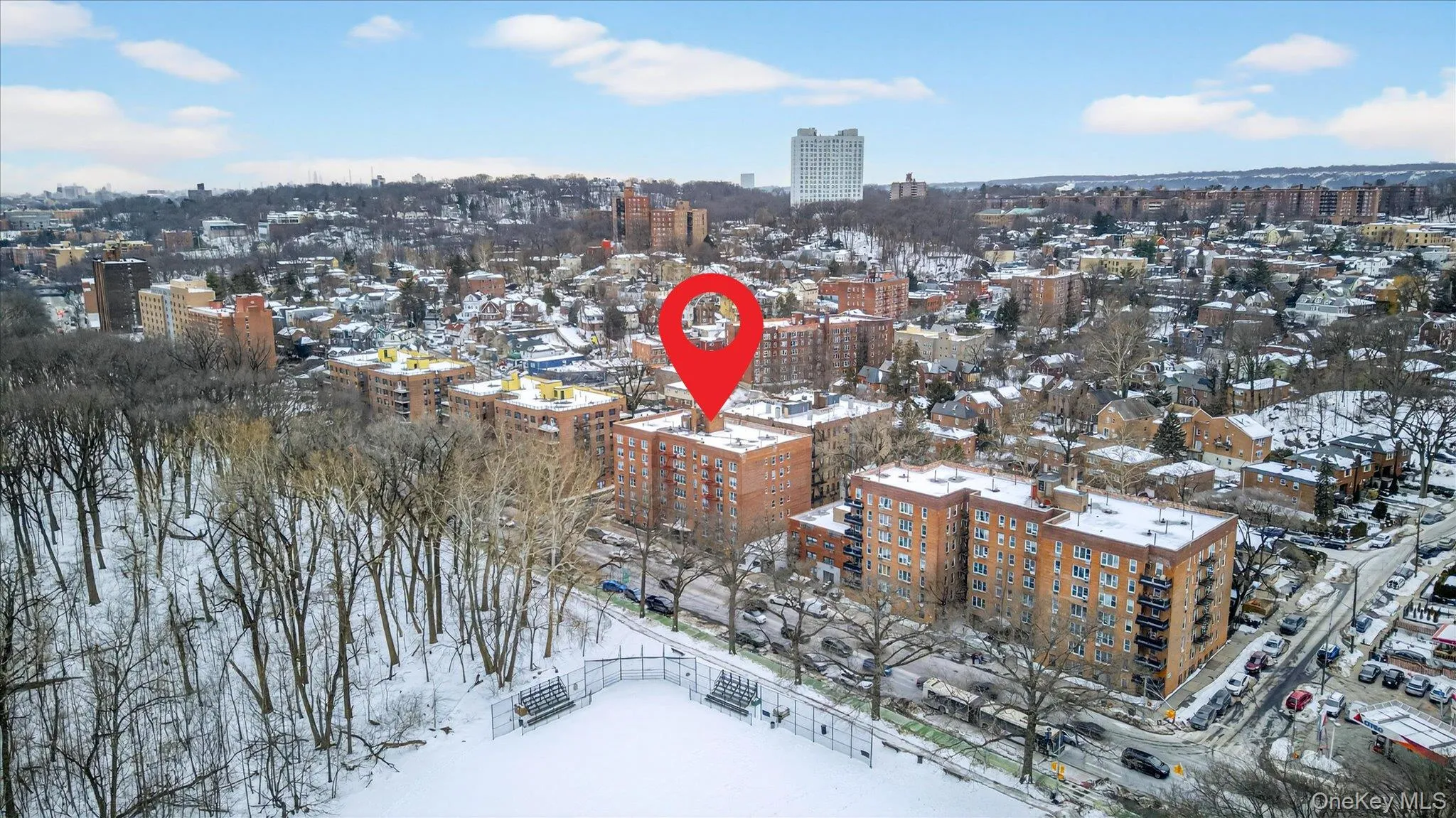 Snowy aerial view featuring a view of city Snowy aerial view featuring a view of city