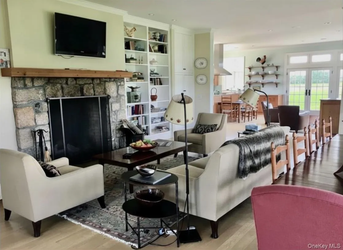 The Open Floor Plan with Large Fireplace is Inviting and Perfect for Entertaining The Open Floor Plan with Large Fireplace is Inviting and Perfect for Entertaining