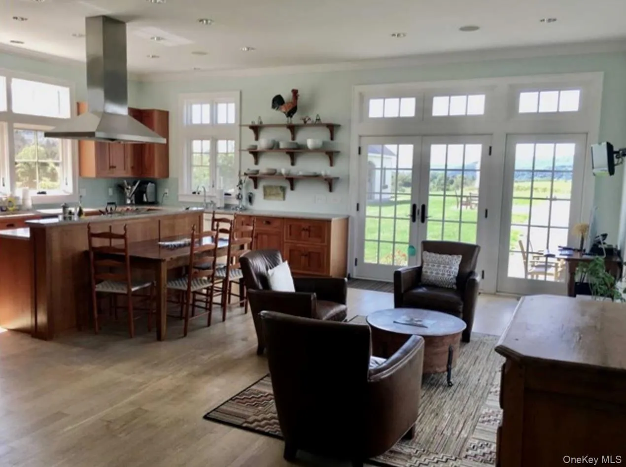 Light-Filled Kitchen & Seating Area with exquisite Views & French Doors to Pool & Bluestone Patio Light-Filled Kitchen & Seating Area with exquisite Views & French Doors to Pool & Bluestone Patio