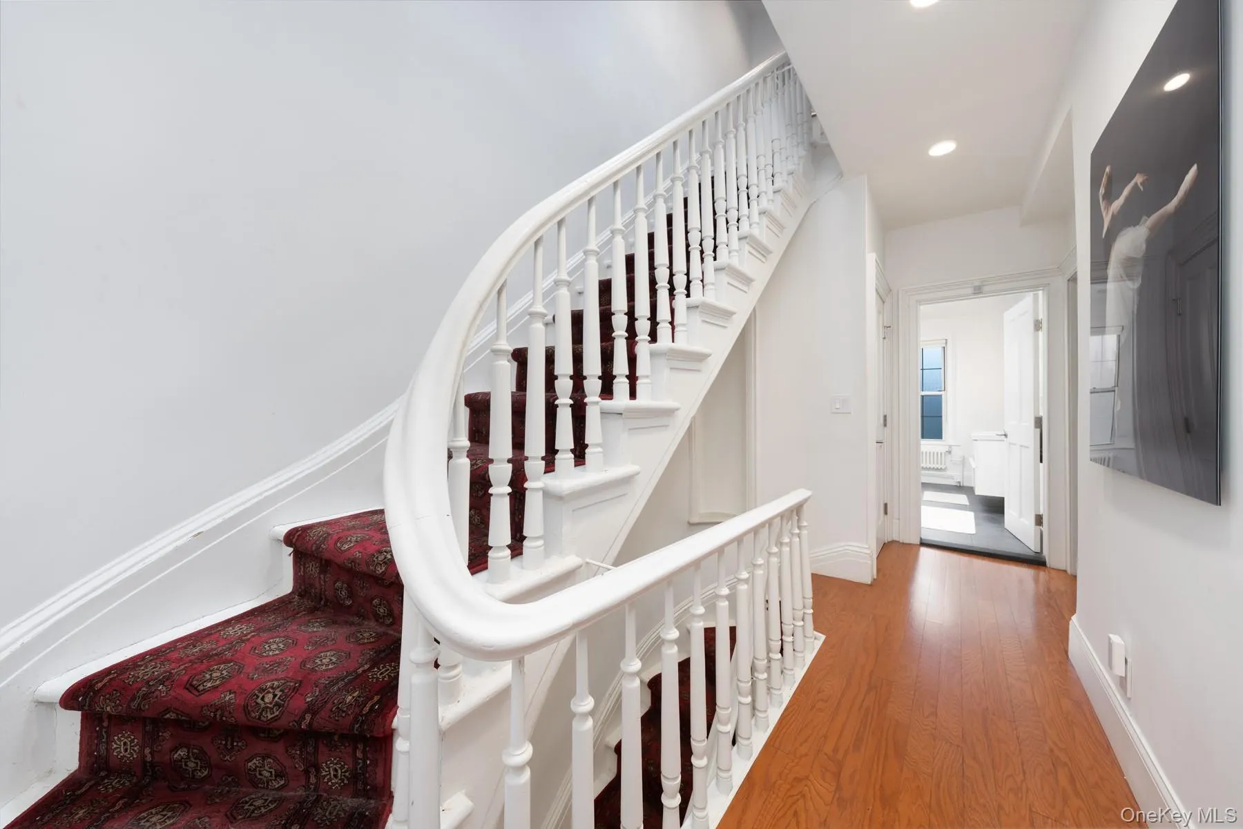Hallway with stairs leading to top floor Hallway with stairs leading to top floor