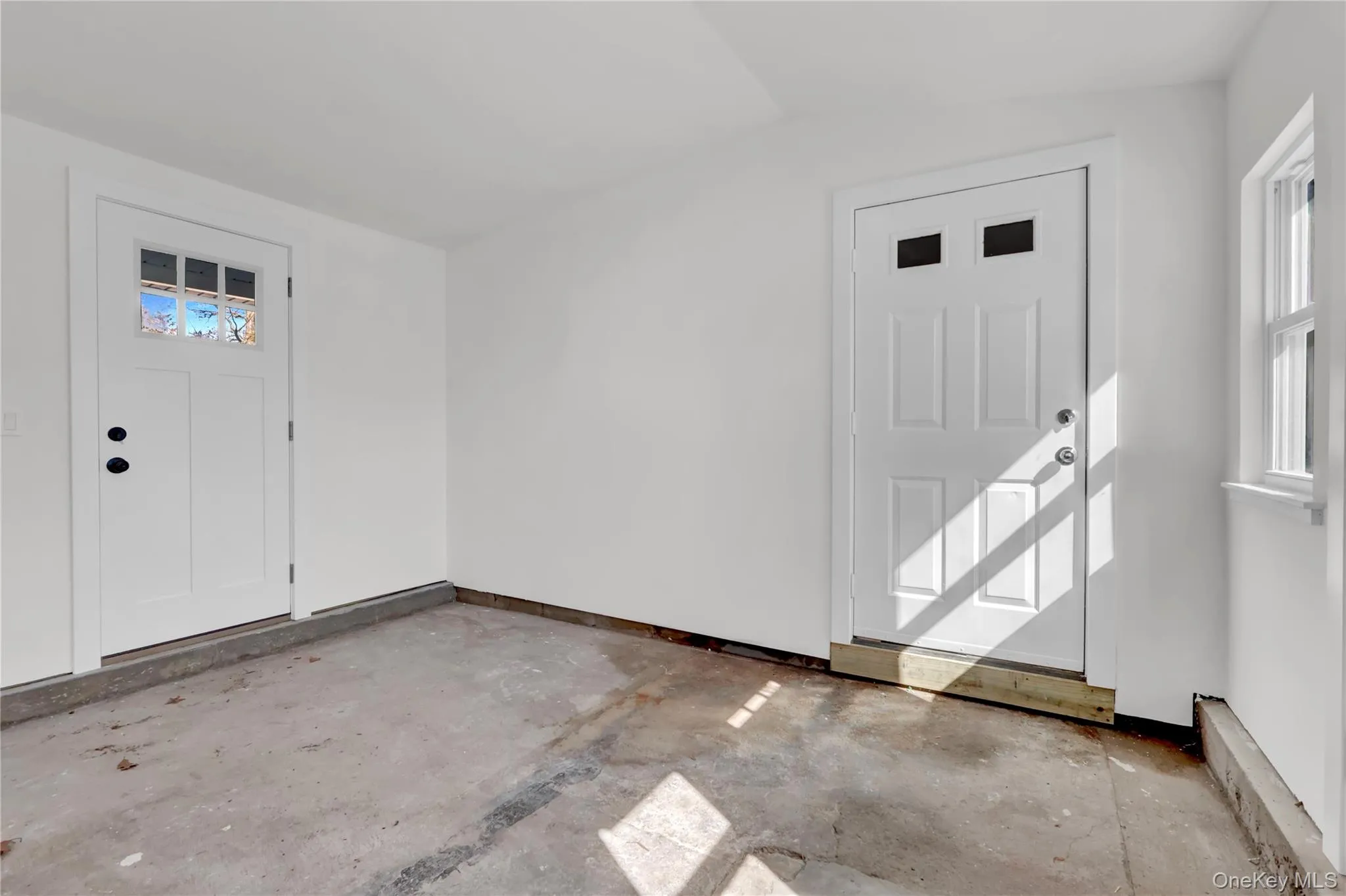 door on right brings you to covered porch and side/back yard, door to garage and door to driveway door on right brings you to covered porch and side/back yard, door to garage and door to driveway