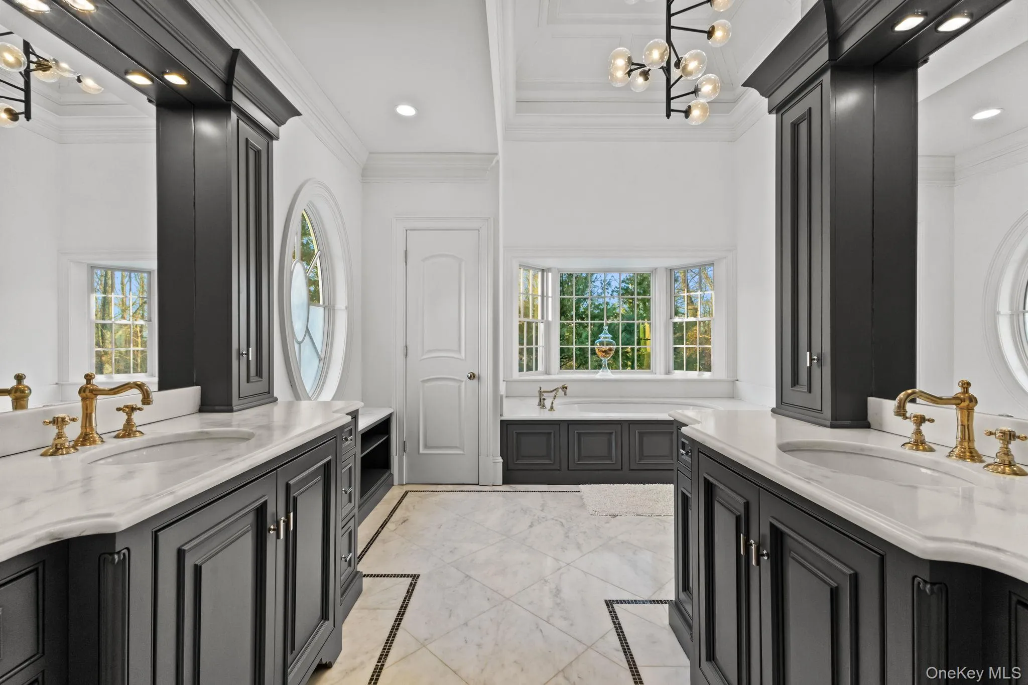 Living up to every expectation, the owner’s bathroom is a spa-like retreat, complete with an oversized glass-enclosed shower featuring dual controls and shower heads, separate vanities, a private toilet closet, and a spacious walk-in linen closet and radiant heat flooring Living up to every expectation, the owner’s bathroom is a spa-like retreat, complete with an oversized glass-enclosed shower featuring dual controls and shower heads, separate vanities, a private toilet closet, and a spacious walk-in linen closet and radiant heat flooring