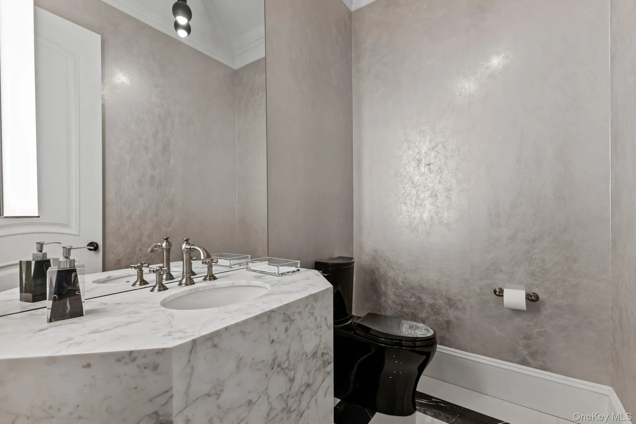 A stunning Powder Room featuring a designer marble sink, custom ceiling-height mirror, curated designer flooring, elegant lighting, and sophisticated hand painted Pho Venetian Plaster walls A stunning Powder Room featuring a designer marble sink, custom ceiling-height mirror, curated designer flooring, elegant lighting, and sophisticated hand painted Pho Venetian Plaster walls