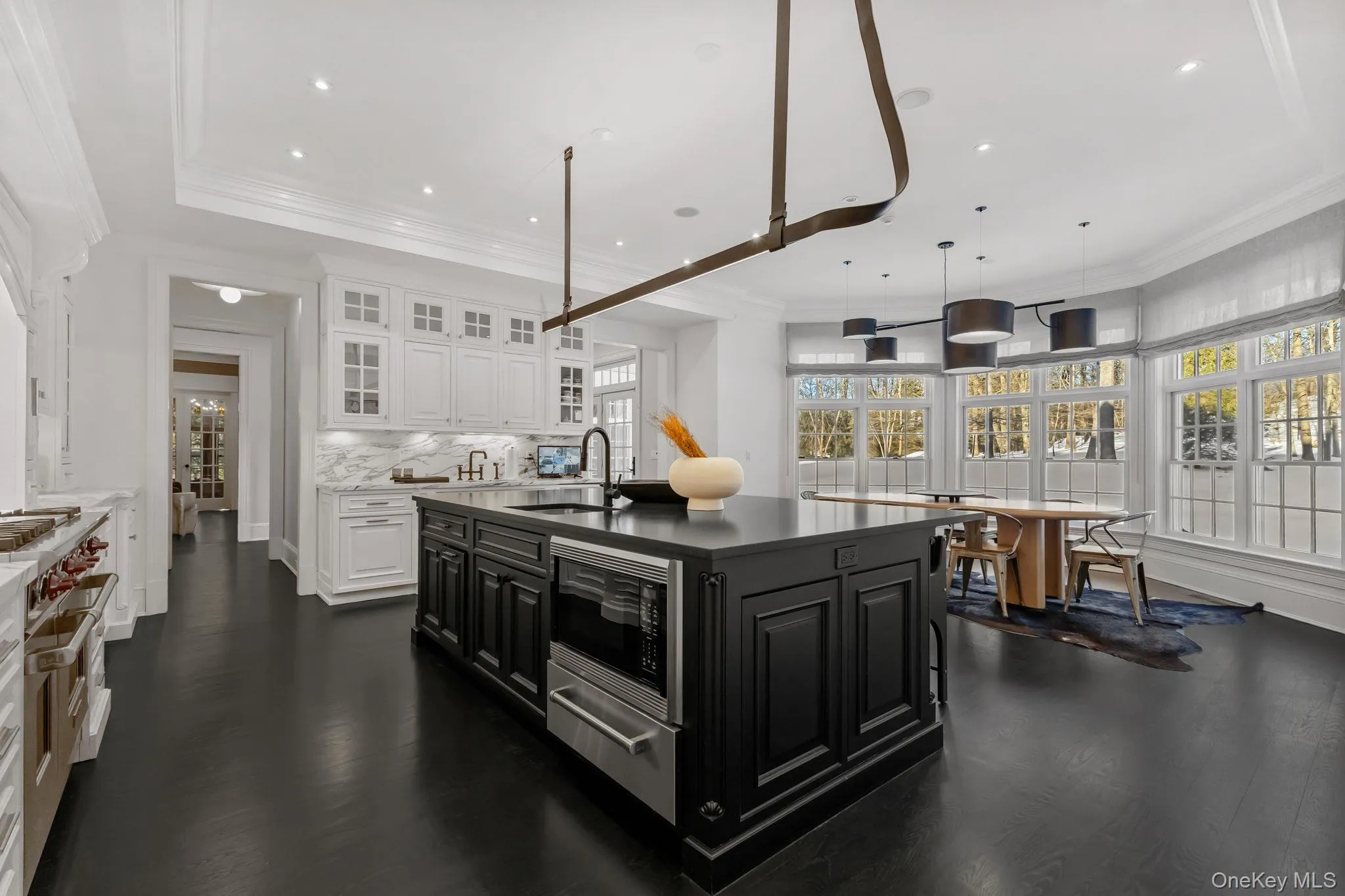 Designer fixtures, abundant natural light, and integrated in-wall speakers elevate this kitchen from exceptional to a true work of art. Designer fixtures, abundant natural light, and integrated in-wall speakers elevate this kitchen from exceptional to a true work of art.