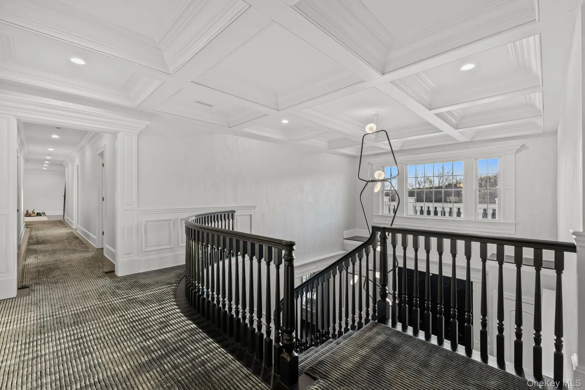 Exquisite details that define the main level continue seamlessly up the stairs, culminating in a spacious and elegantly styled landing. Exquisite details that define the main level continue seamlessly up the stairs, culminating in a spacious and elegantly styled landing.