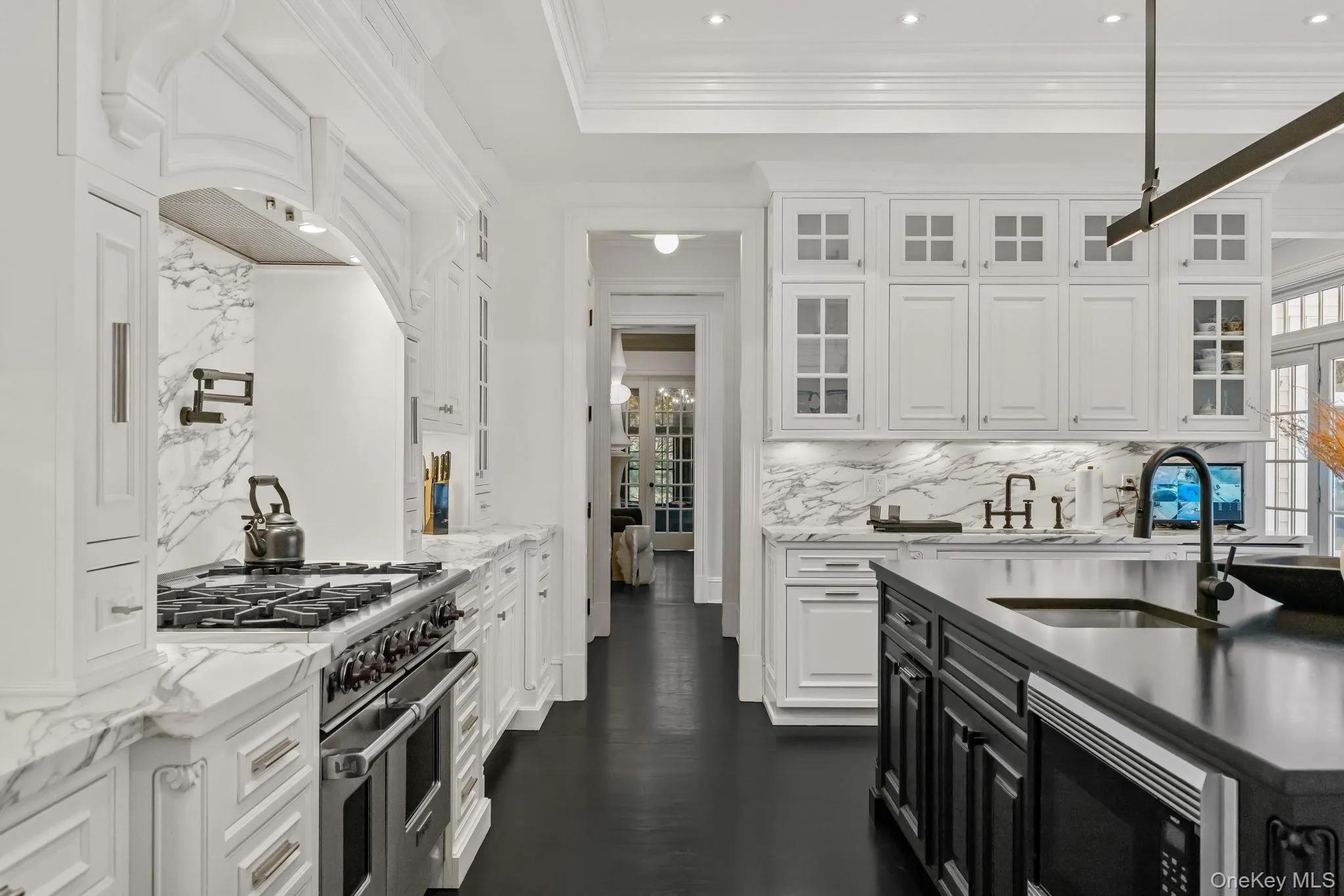 Whether entering from the formal rooms or stepping in from outdoors, this centrally located kitchen is perfectly positioned to serve every need with ease and efficiency. Whether entering from the formal rooms or stepping in from outdoors, this centrally located kitchen is perfectly positioned to serve every need with ease and efficiency.
